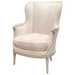 19th Century Louis XVI Carved Painted Bergère Armchair with Striped Fabric