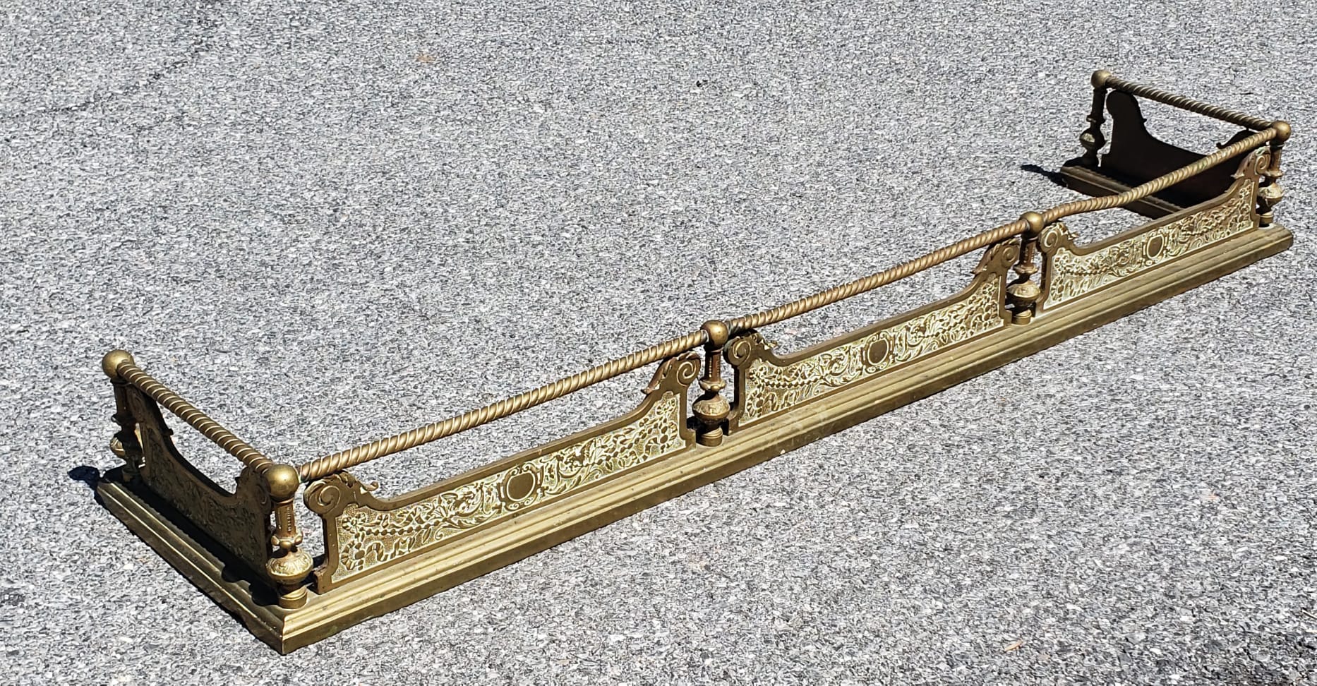 A 19th Century Louis XVI Cast Brass and Iron Ornate Fireplace Fender .
Measures 60