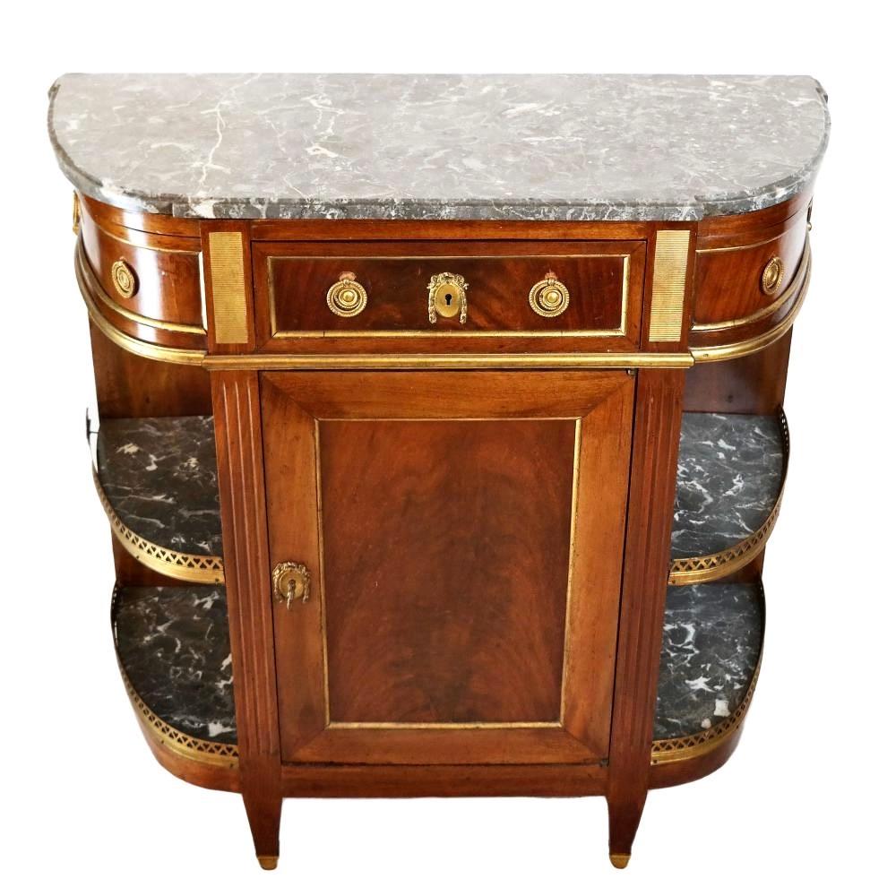 Wonderful Louis XVI mahogany and marble top console desserte. Original marble and ormolu mounts. Cabinet door.