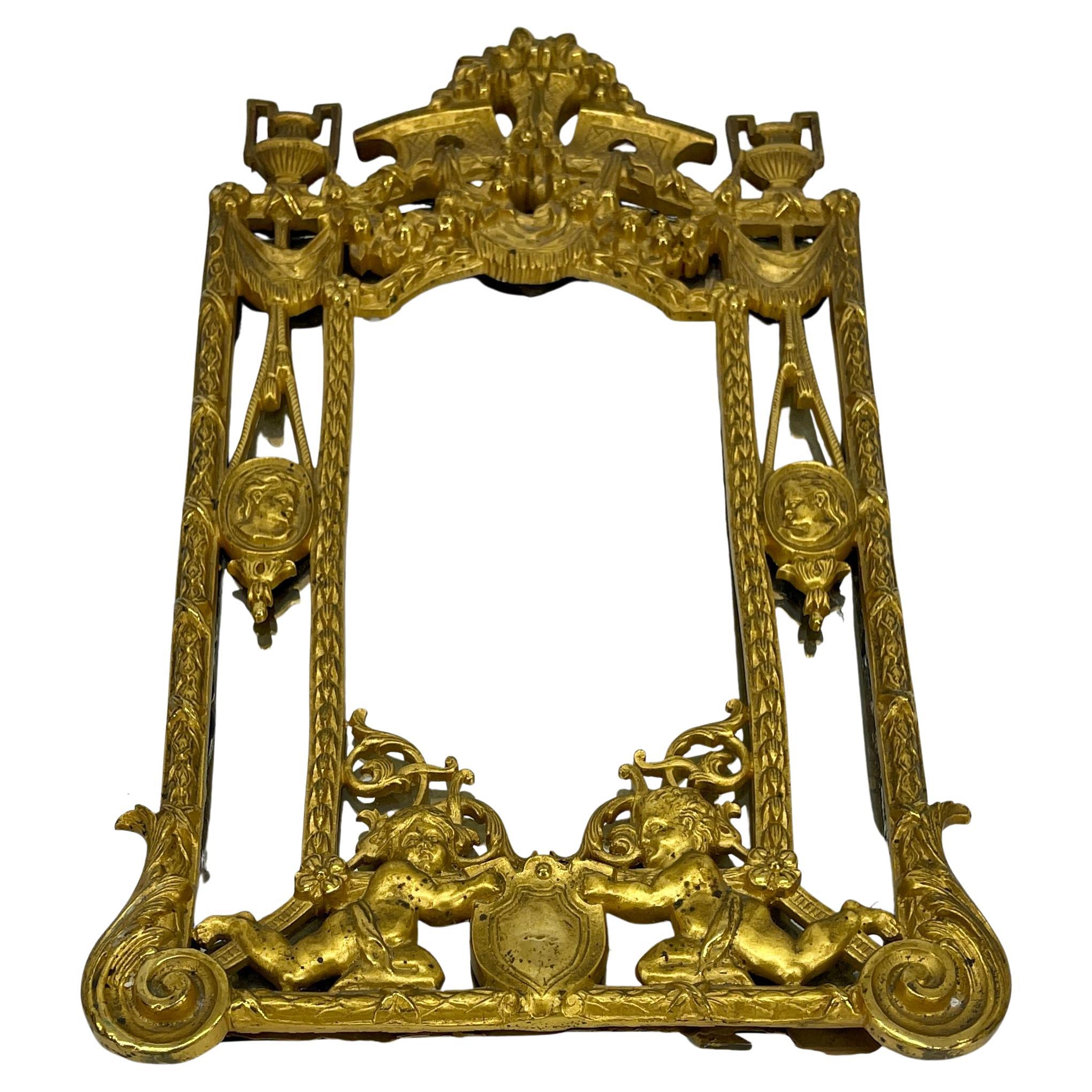 19th Century Louis XVI Gilded Bronze Vanity MirrorThis fine table mirror is of the Empire style, early 19th century. The mirror is designed in dual layered arch form, featuring a larger outer arch and a smaller inner arch. There is a large mirrored