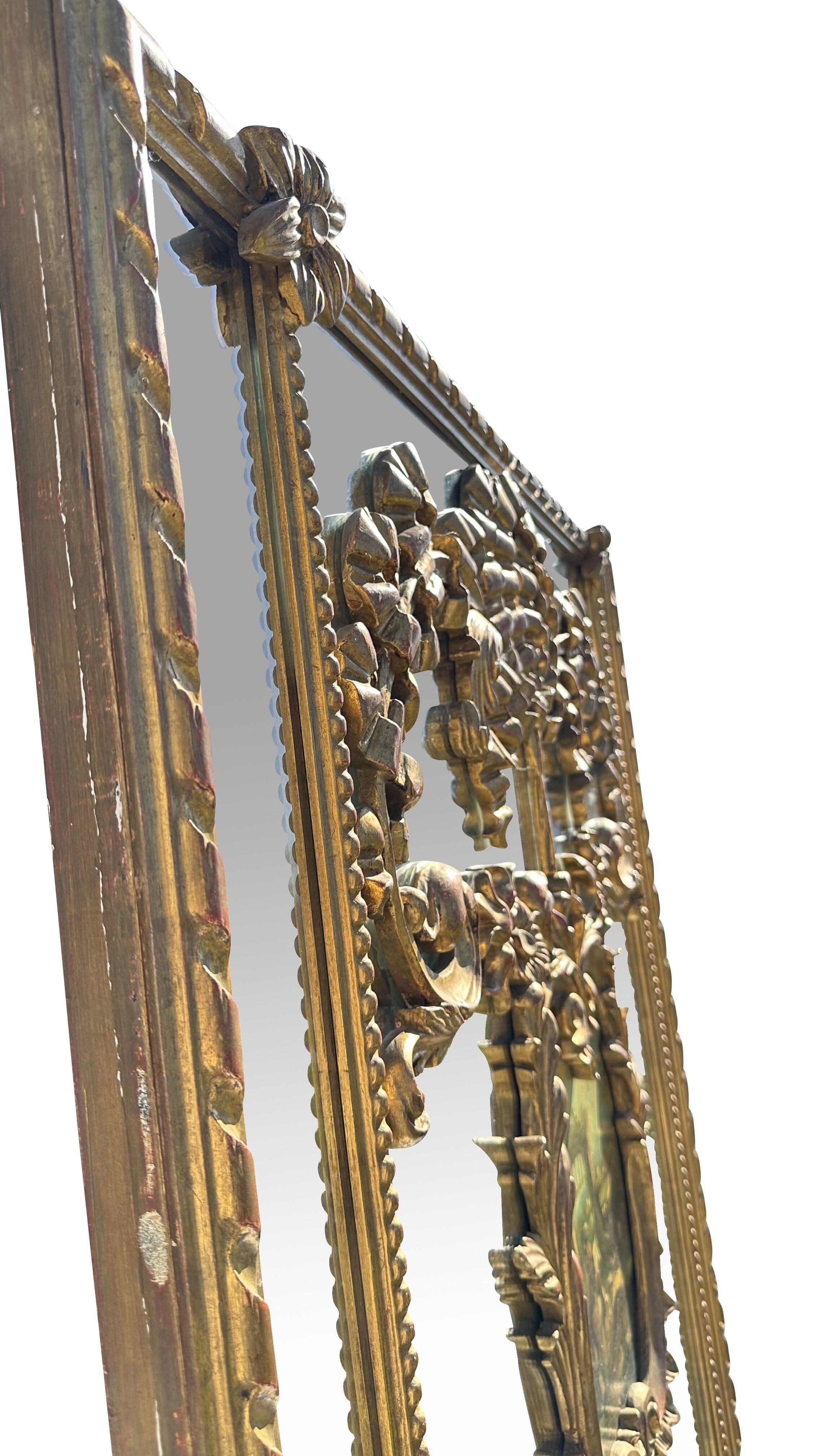 A large and finely carved 19th century? louis XV st. Gilt wood French trumeaux. The piece has all its original gilt, mirror and painted central horseback rider scene. The mirror's rectangular shape and generous proportions make it a versatile piece