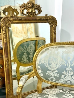 Specchio consolle Luigi XVI del XIX secolo in legno dorato con dettagli intagliati