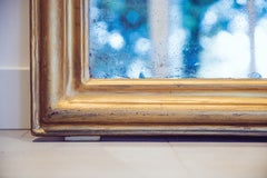 19th Century Louis XVI Giltwood Mirror with Urn Motif Crest