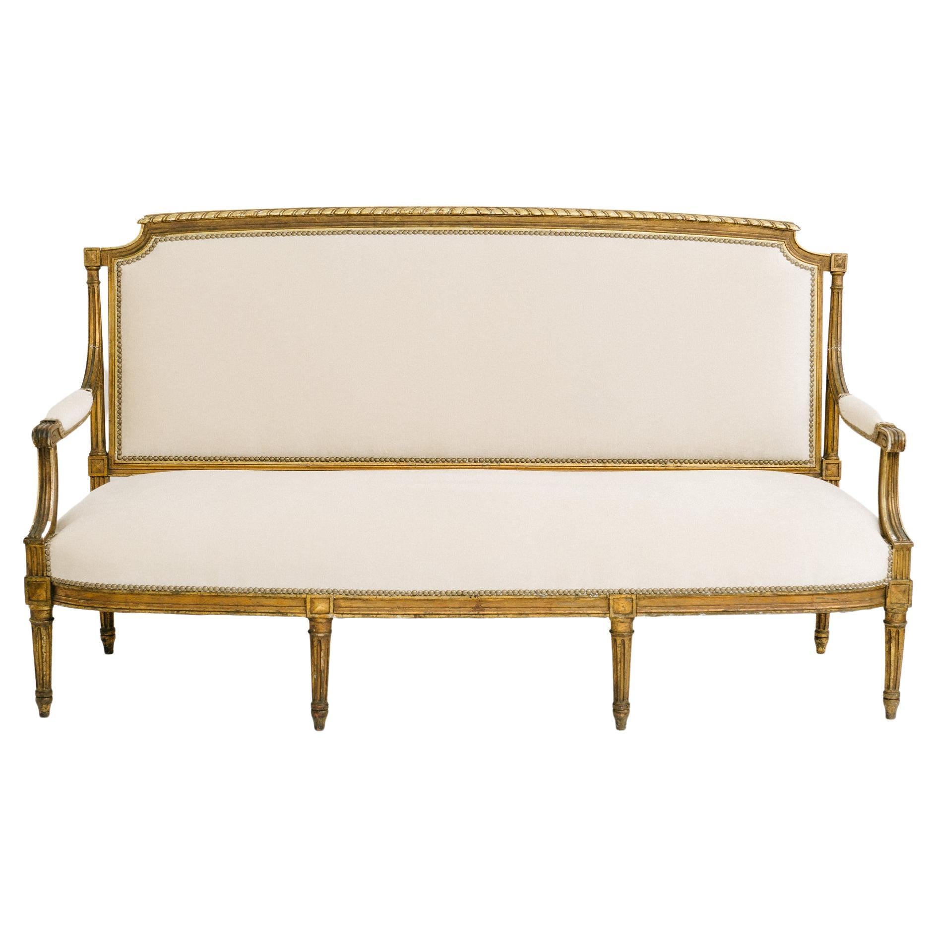 Canapé en bois doré Louis XVI du 19ème siècle en vente