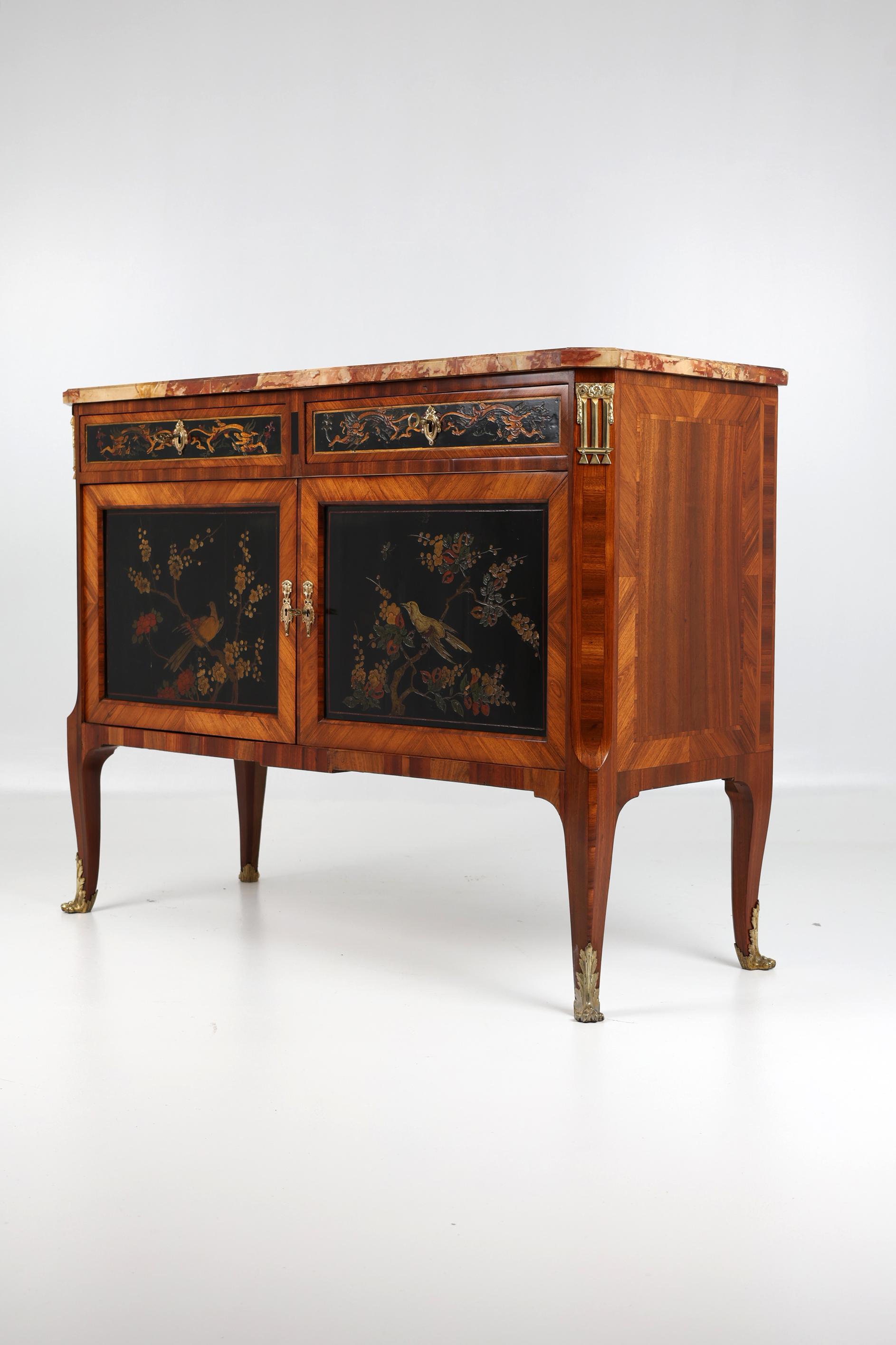 19th Century Louis XVI style half cabinet with Chinese lacquer,
Rosewood, 
France 1850

A very unusual and decorative rosewood half cabinet or commode, raised on cabroile legs with ormolu mounts above which are decorated doors with Chinese lacquer