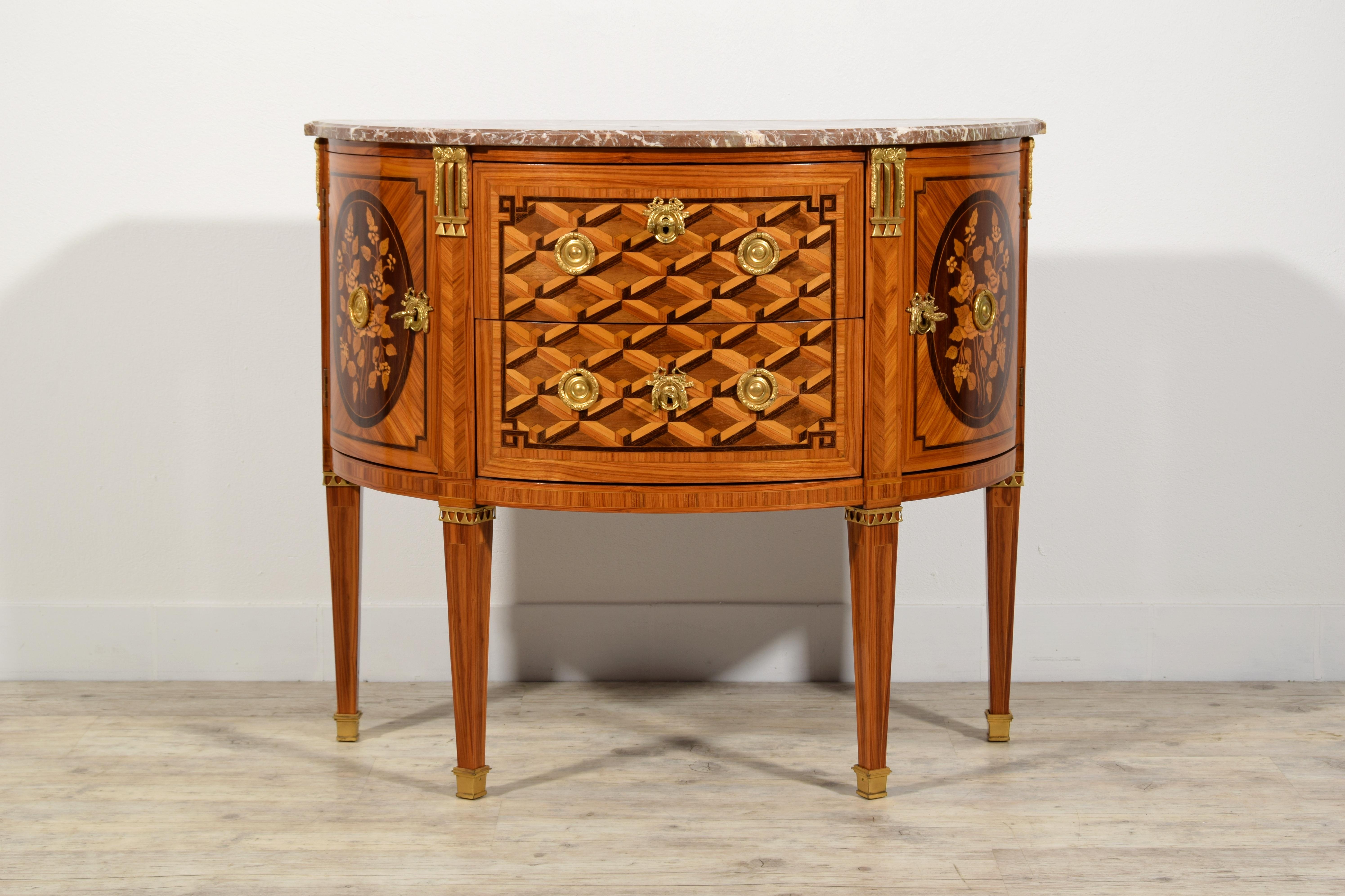 19th Century, Louis XVI Half Moon Veneered and Inlaid Wood French Commode

The elegant crescent commode was made in the first half of the 19th century in France. The wooden structure is veneered and finely inlaid with wooden essences with different