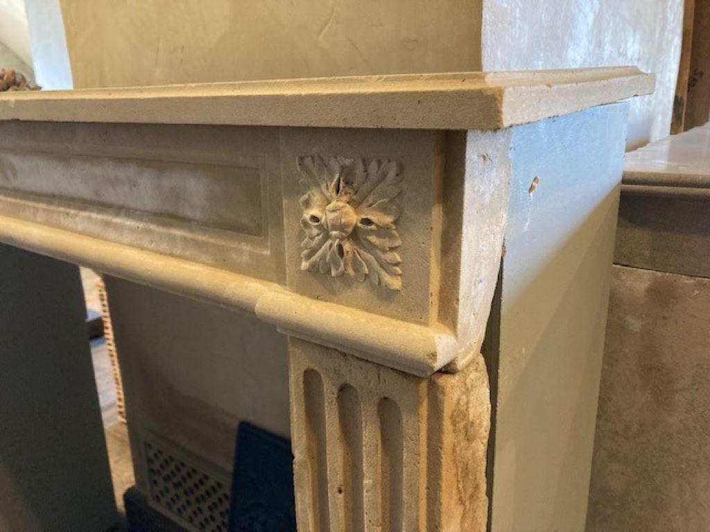 Carved 19th Century Louis XVI Limestone Fireplace For Sale
