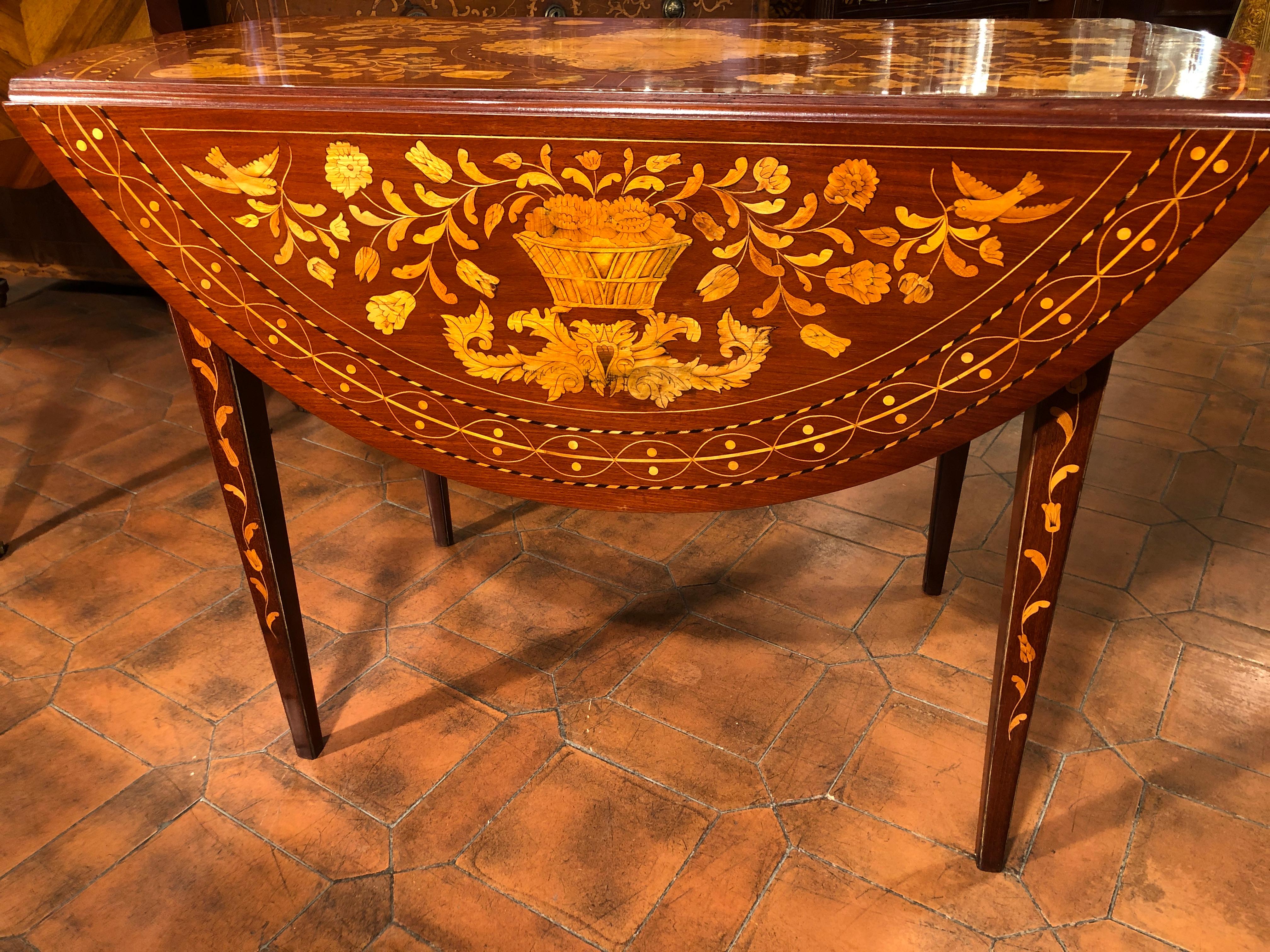 Sofa table from the Netherlands, in full Dutch style in tarsia, famous throughout Europe. It is thought that the Holland produced furniture of different shapes and inlays according to the country that ordered the furniture.
This Sofa Table was for