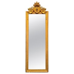Miroir de sol étroit en bois sculpté et doré Louis XVI du 19ème siècle