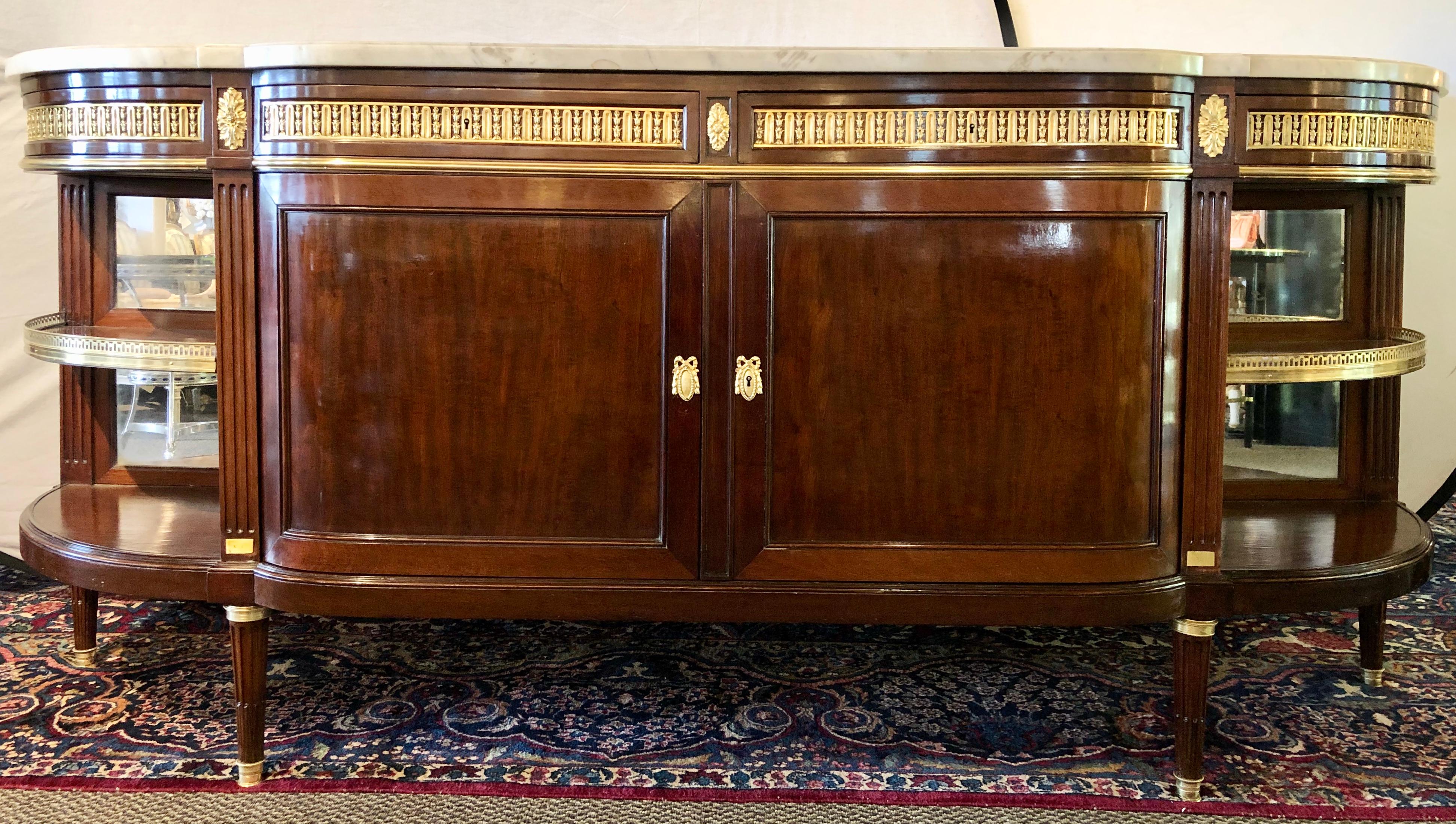19th century Louis XVI sideboard, cabinet or console by Maison Forest. This finely constructed mahogany cabinet by this highly regarded cabinet maker has a thick white marble top supported by a monumental case of double doors under four drawers with