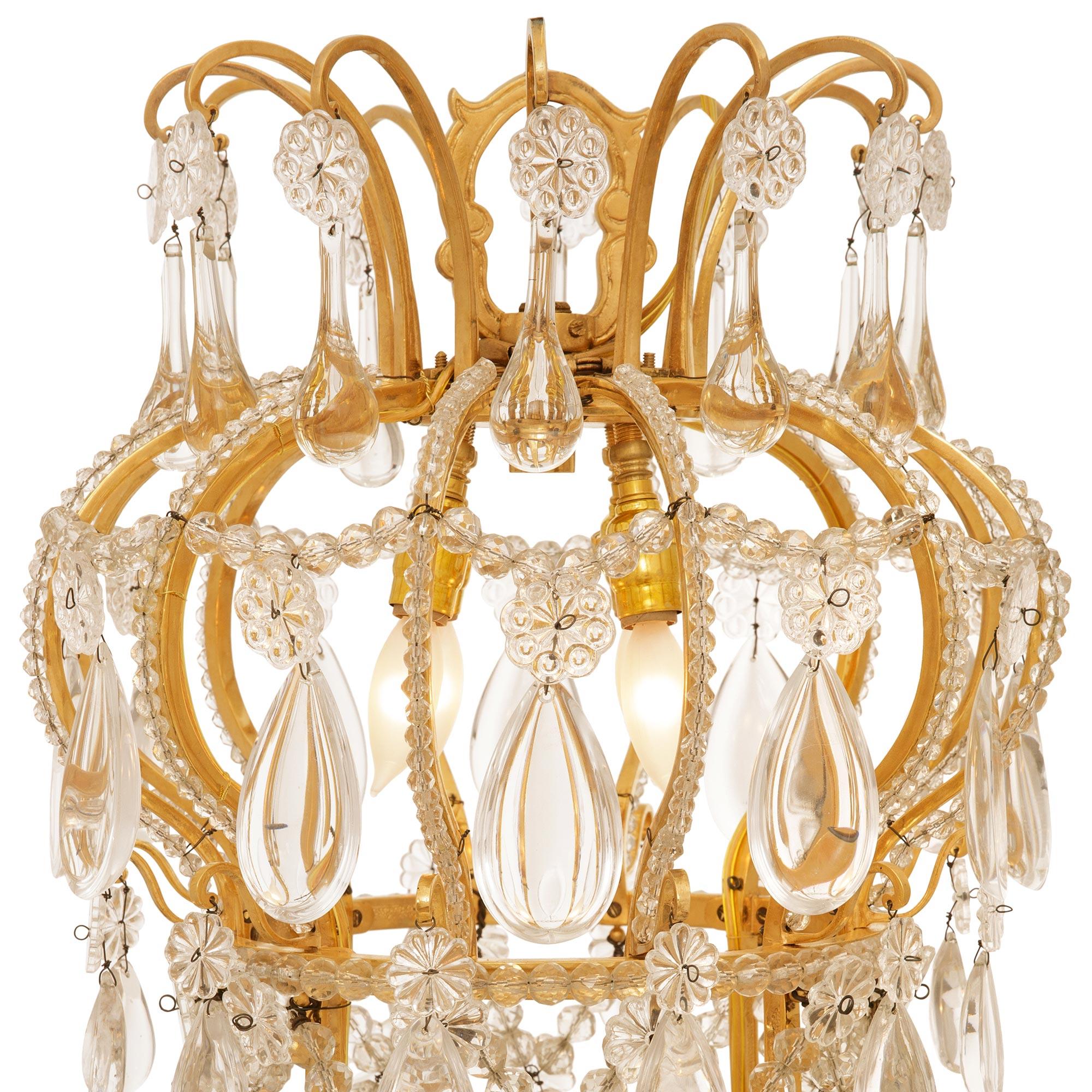 19th century Louis XVI st. Ormolu and Baccarat Crystal chandelier In Good Condition For Sale In West Palm Beach, FL