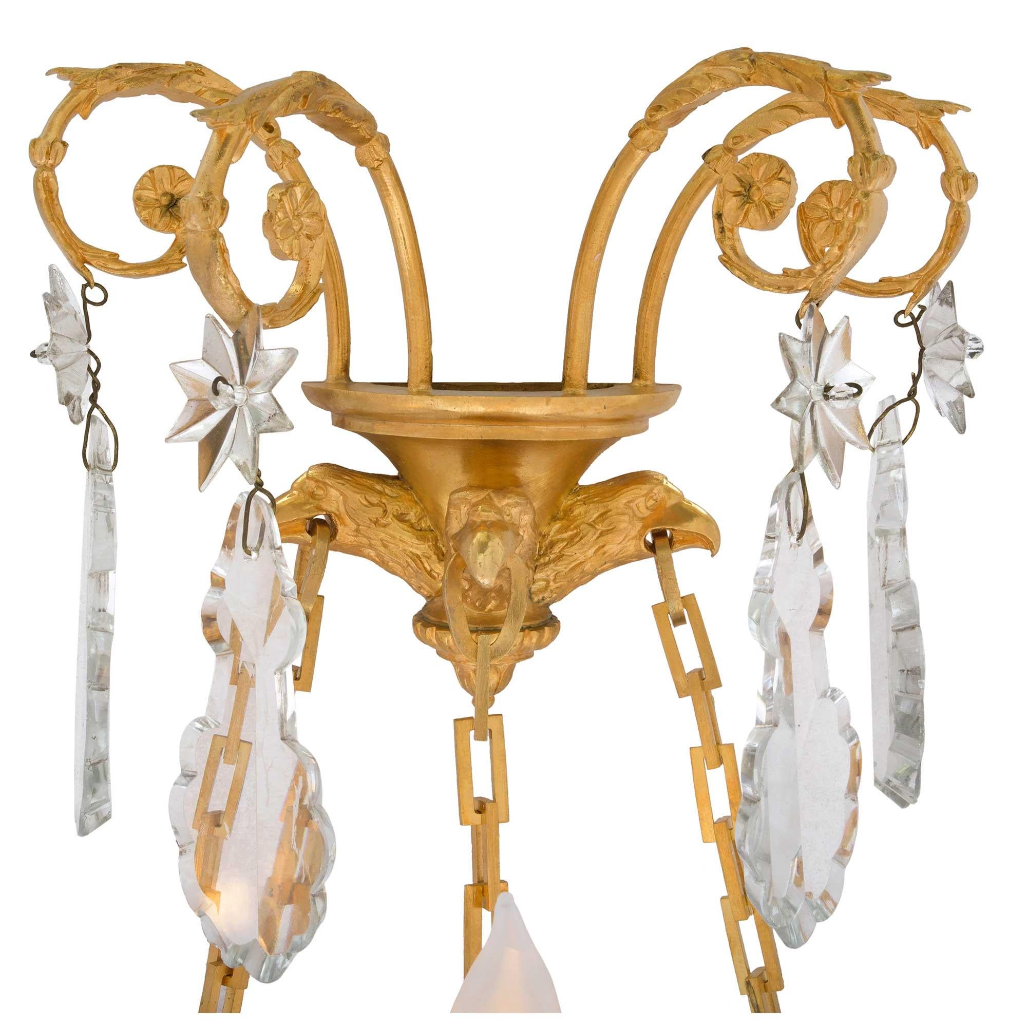 French 19th Century Louis XVI Style Baccarat Crystal and Ormolu Three-Light Sconces For Sale