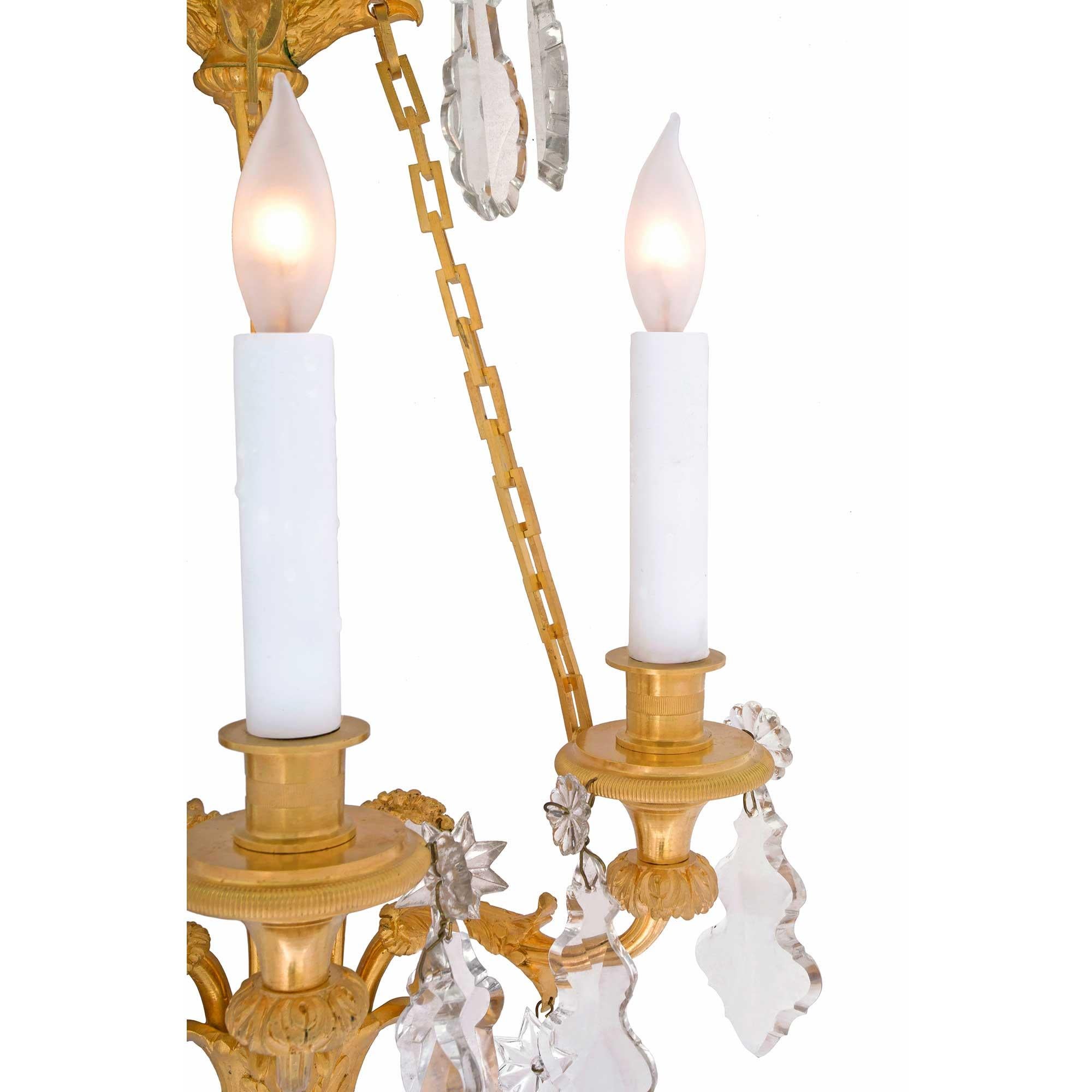 19th Century Louis XVI Style Baccarat Crystal and Ormolu Three-Light Sconces For Sale 1