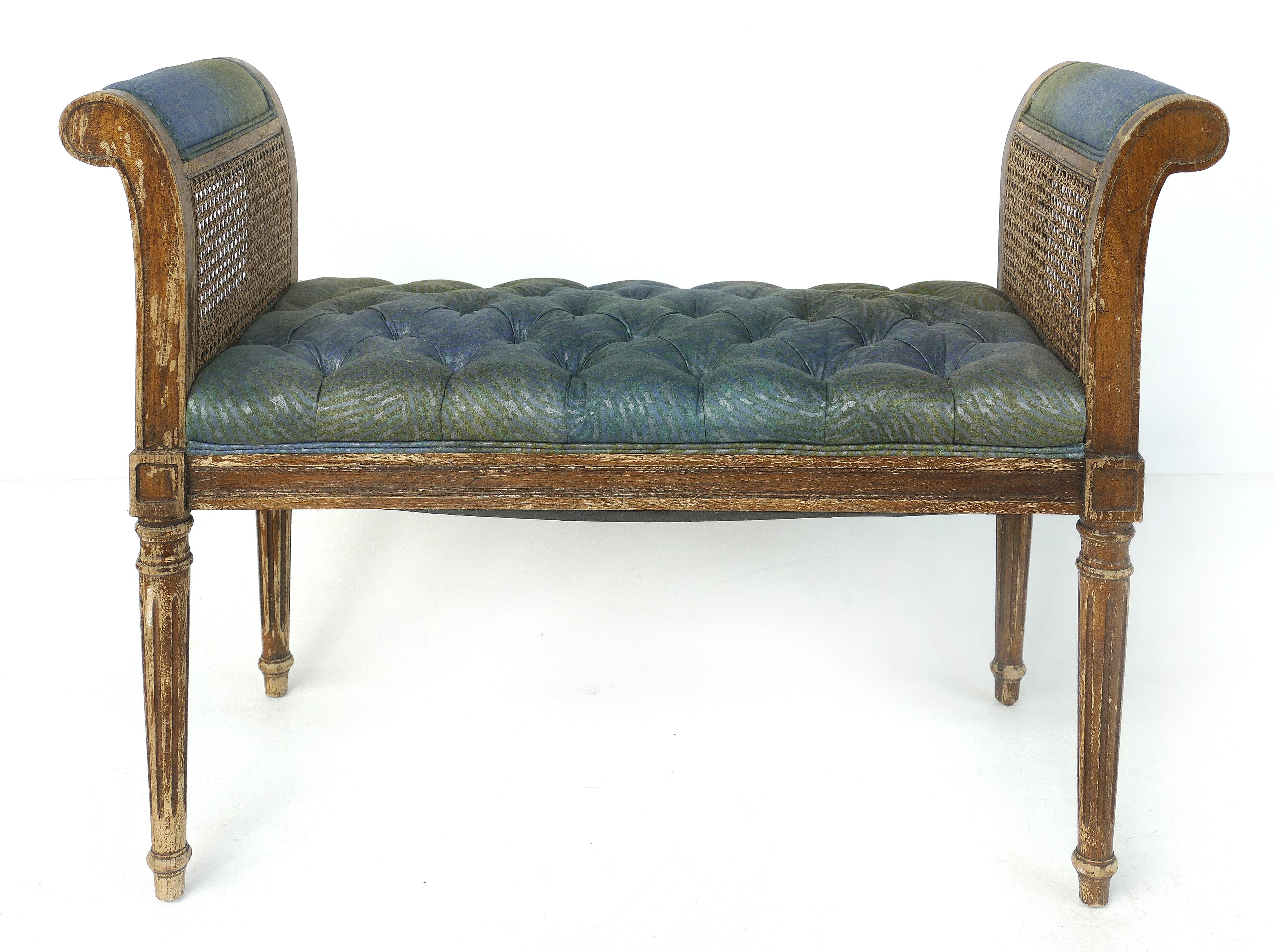 19th century Louis XVI style caned benches with tufted seats and tapering, conical feet

Offered for sale is a pair of Louis XVI style caned benches with tufted upholstered seats. These lovely benches date to the end of the 19th century or