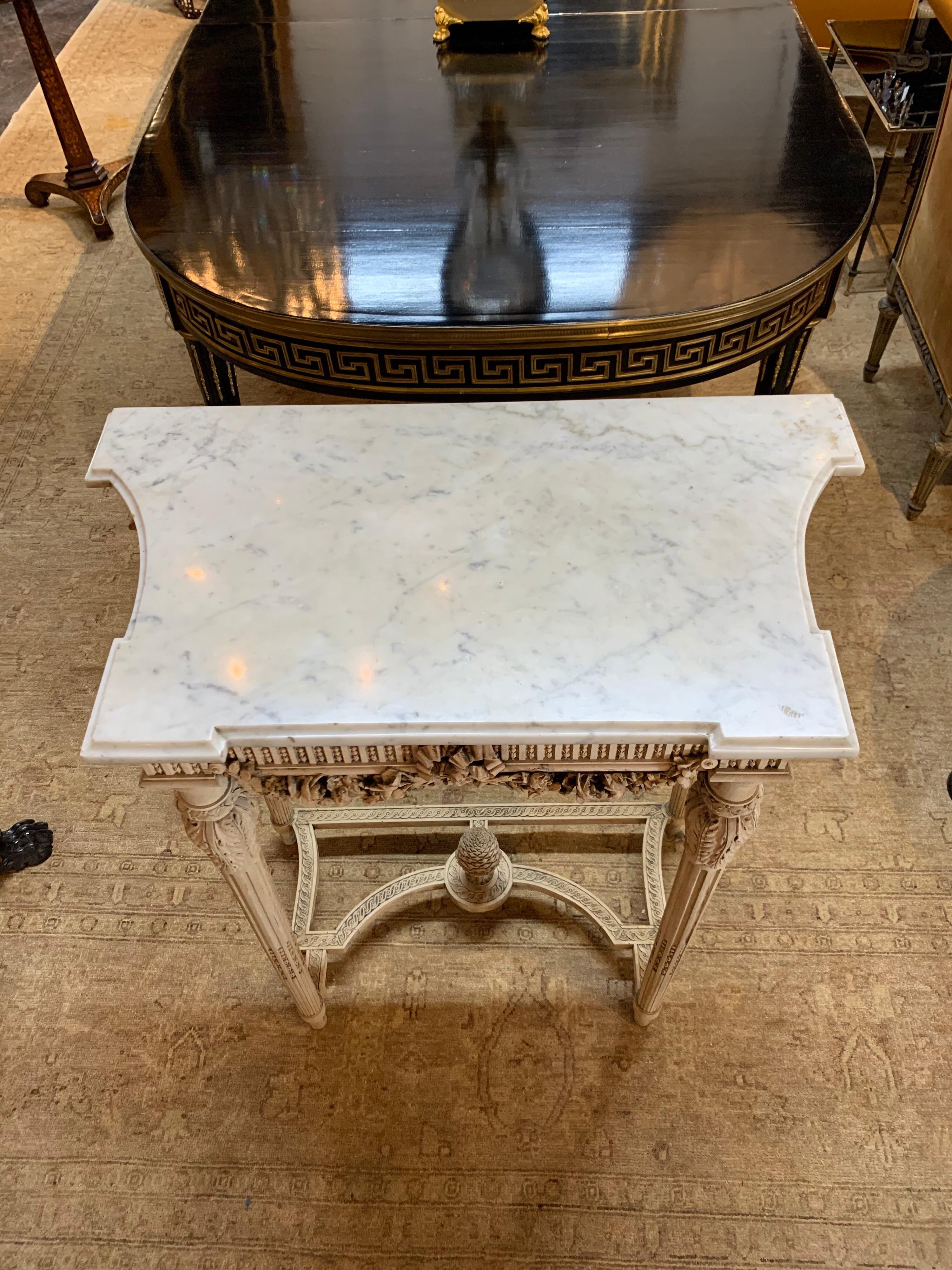 Beautiful 19th century French Louis XVI style console with bleached walnut carved base and a Carrara marble top. Very fine intricate carving makes this piece extra special!