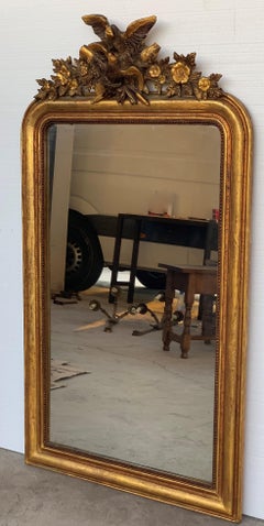 19th Century Louis XVI Style Carved Giltwood Mirror with Eagle and Floral Relief