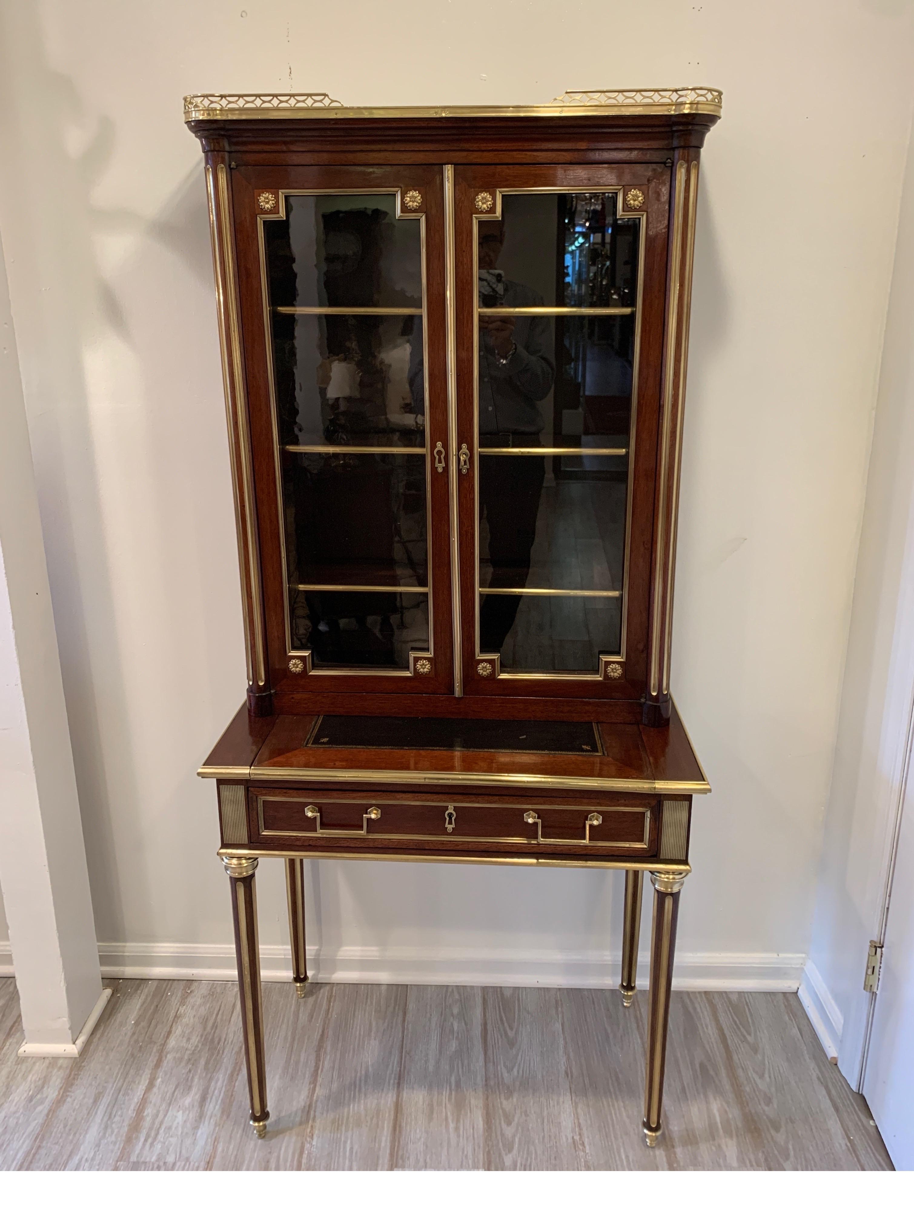 19th century Louis XVI style diminutive two part bookcase on desk/secretary
Beautifully restored and polished, ready to go place in home.
Measures: 65.5
