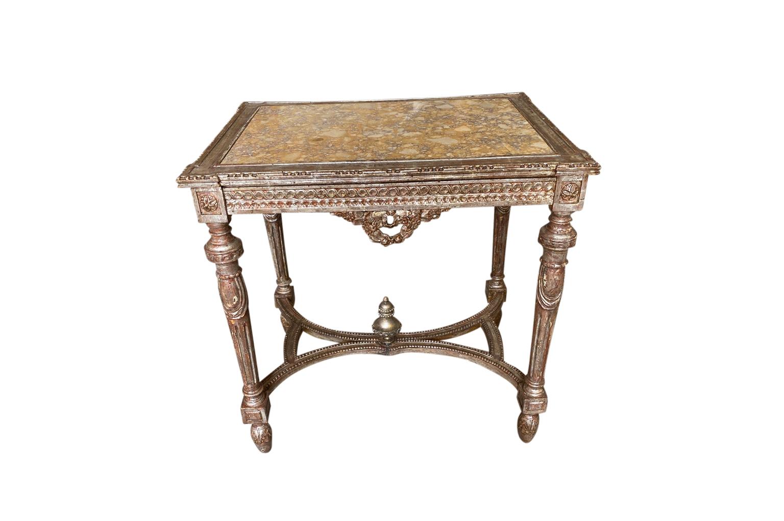 A very beautiful 19th century French Louis XVI style marble top console table - side table. Beautifully constructed from silvered gilt wood and a stunning marble inset top surface. A very lovely piece that will add elegance to its surrounding.