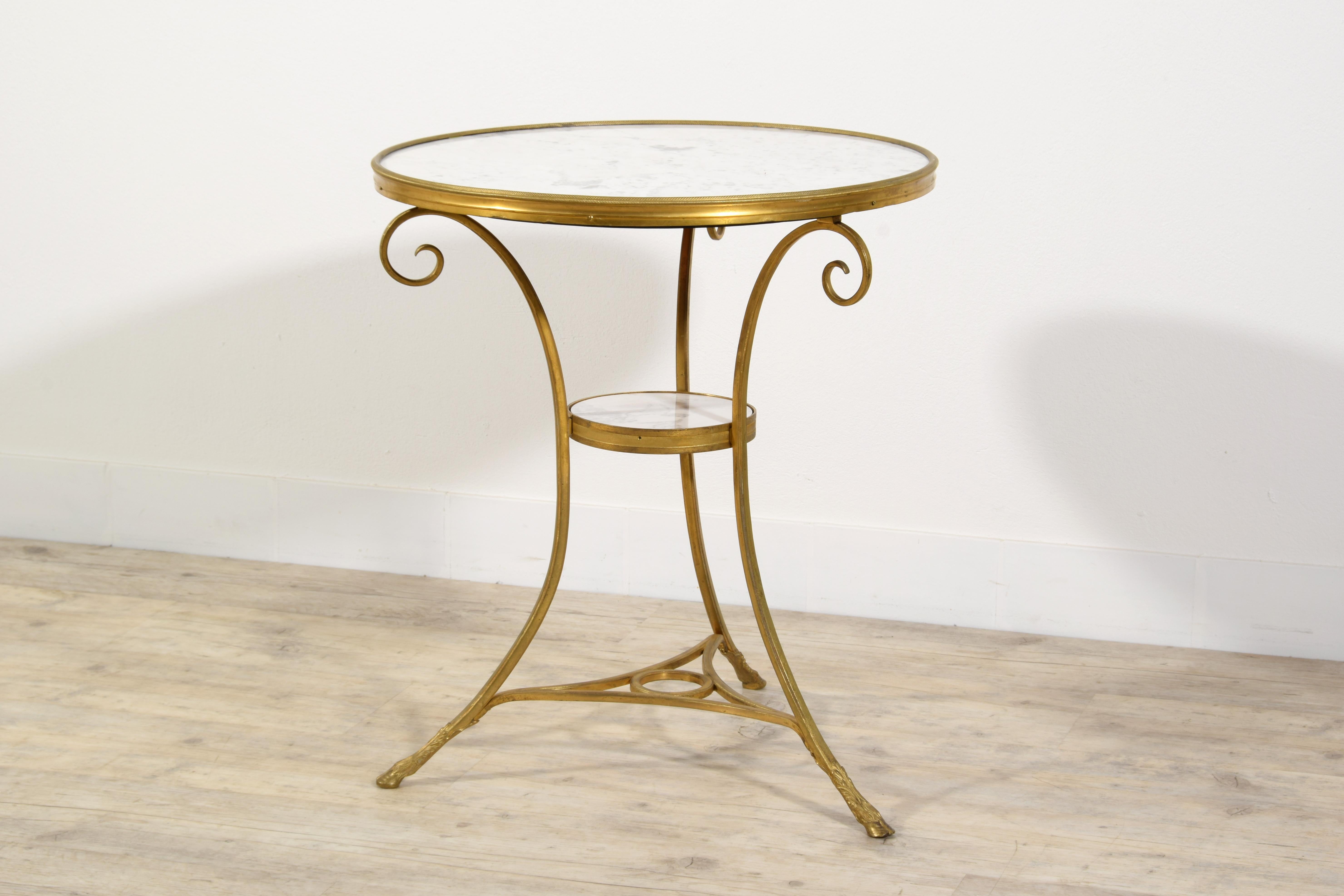 Louis XVI style French gilt bronze tripod coffee table or guéridon
France, late 19th century

The elegant coffee table or guéridon was made in France, towards the end of the 19th century, in the style of the Louis XVI period.
The double top white