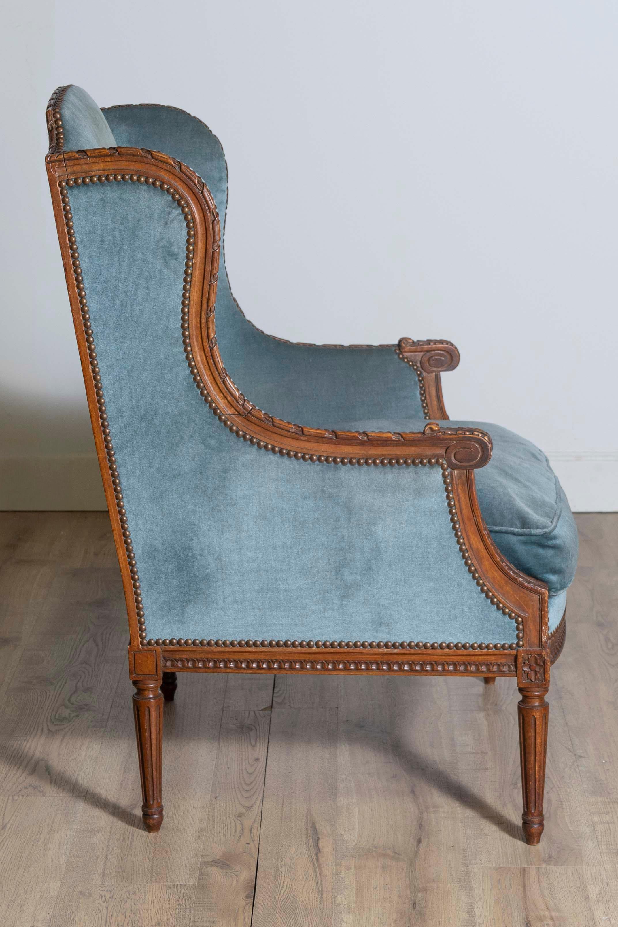 19th Century Louis XVI Style French Walnut Bergère à Oreilles with Carved Décor In Good Condition For Sale In Atlanta, GA