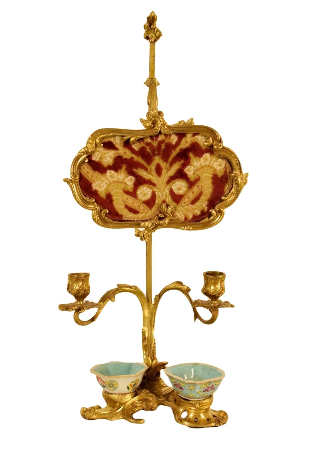 19th Century French Gilt Bronze Desk Candlestick with Cinese Ceramic Inkwell 

This desk lamp was made in France at the beginning of the 19th century, in Louis XV style.
The particular desk candlestick consists of a gilded bronze structure finely