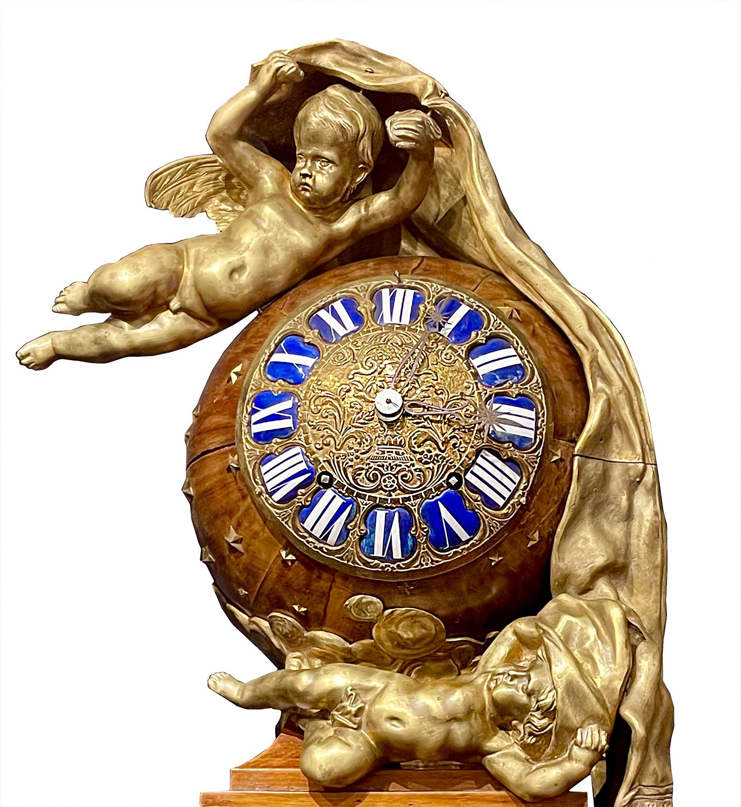 A 19th century Louis XVI Style gilt bronze and mahogany grandfather clock with cherub figures and pendulum. 

Dimensions: 104