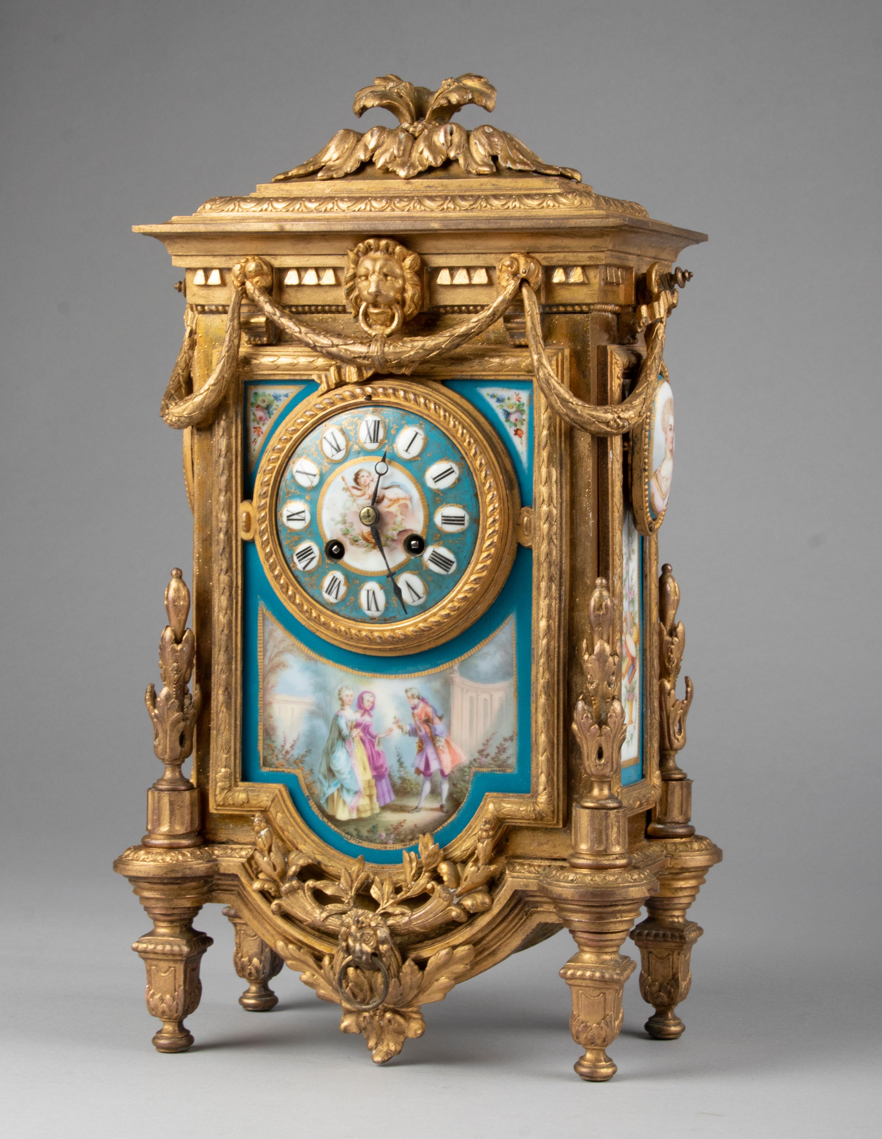 A Louis XVI style French mantel clock, with Sèvres Porcelain panels. The clock is made of casted spelter (zinc alloy) and has a gilt finish. On each side a porcelain portrait of Queen Marie-Antoinette her favorite sister and Maria Carolina. Made in