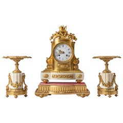 Orologio in bronzo ornato stile Luigi XVI del XIX secolo