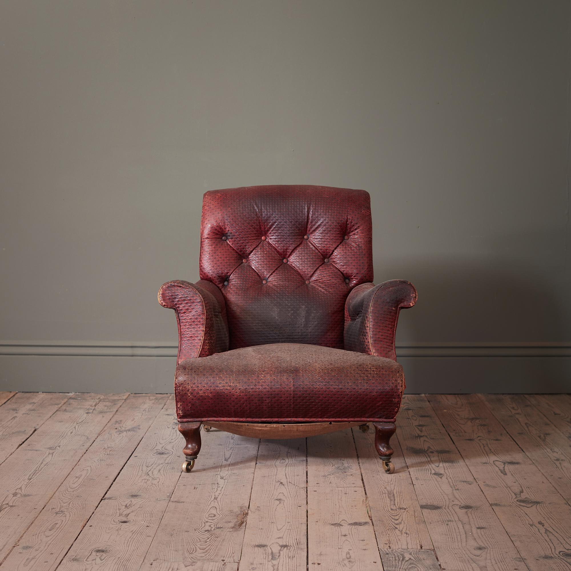 An Early 19th Century Low Armchair, with original Moroccan Red Leather Tooled Upholstery
