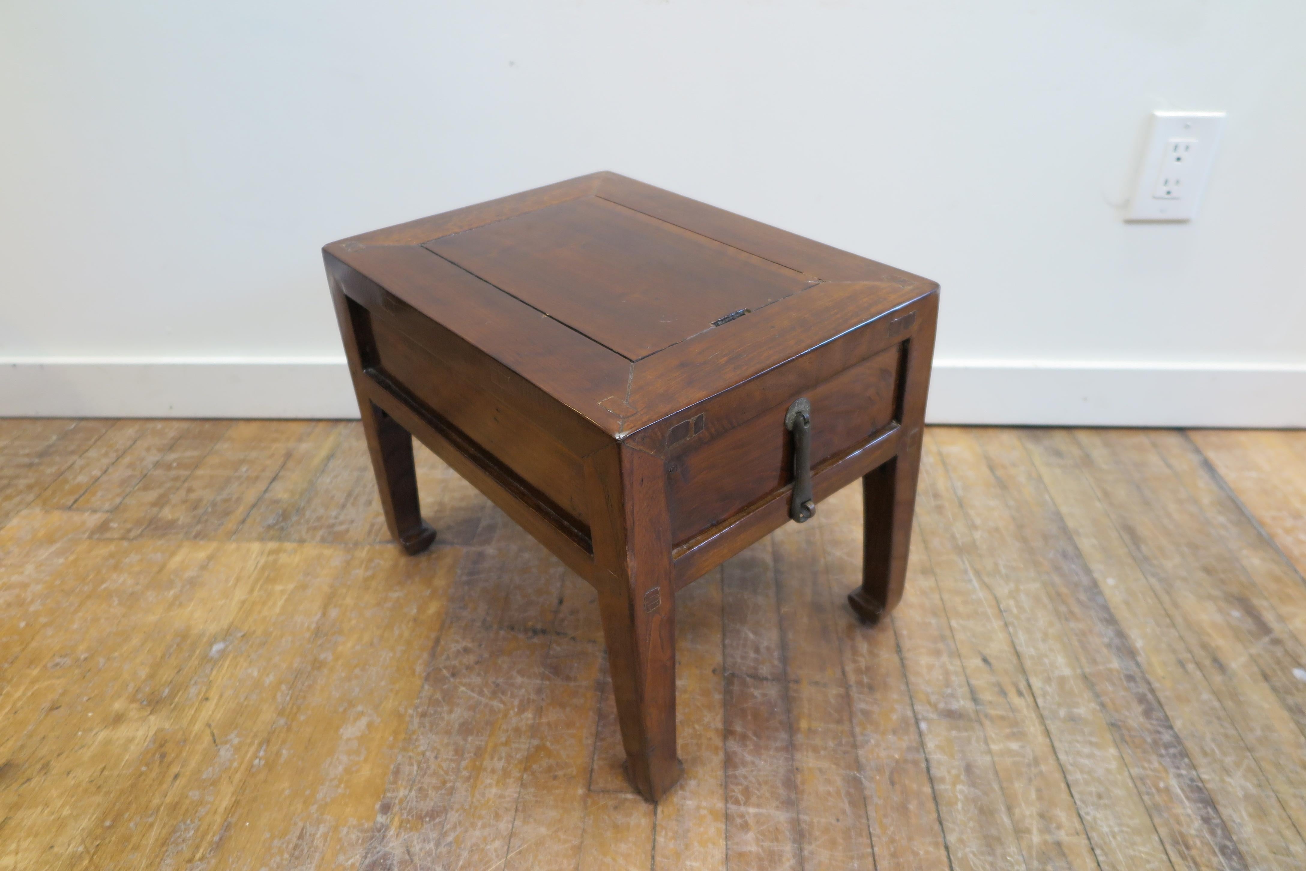 19th century money table, Chinese low table. A small low table of pear wood with one drawer.
Cut into the top is a slot. This opening is to receive money. A merchant would do business on the table and the customer would pay depositing money into