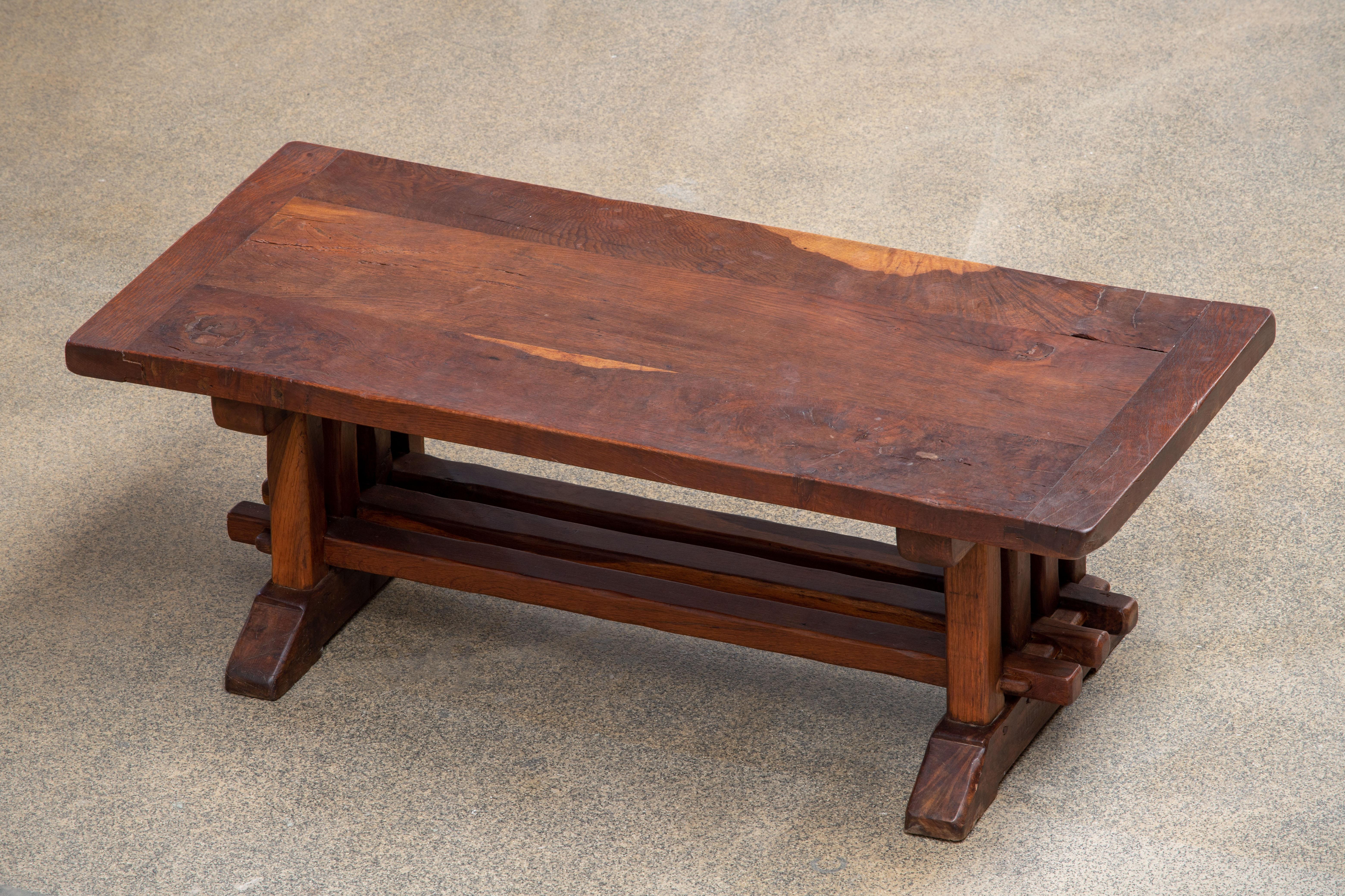A 19th century French monastery coffee table handcrafted in Provence near Avignon of old growth French oak, circa 1890s. This impressive low table retains its beautiful rich color and patina.