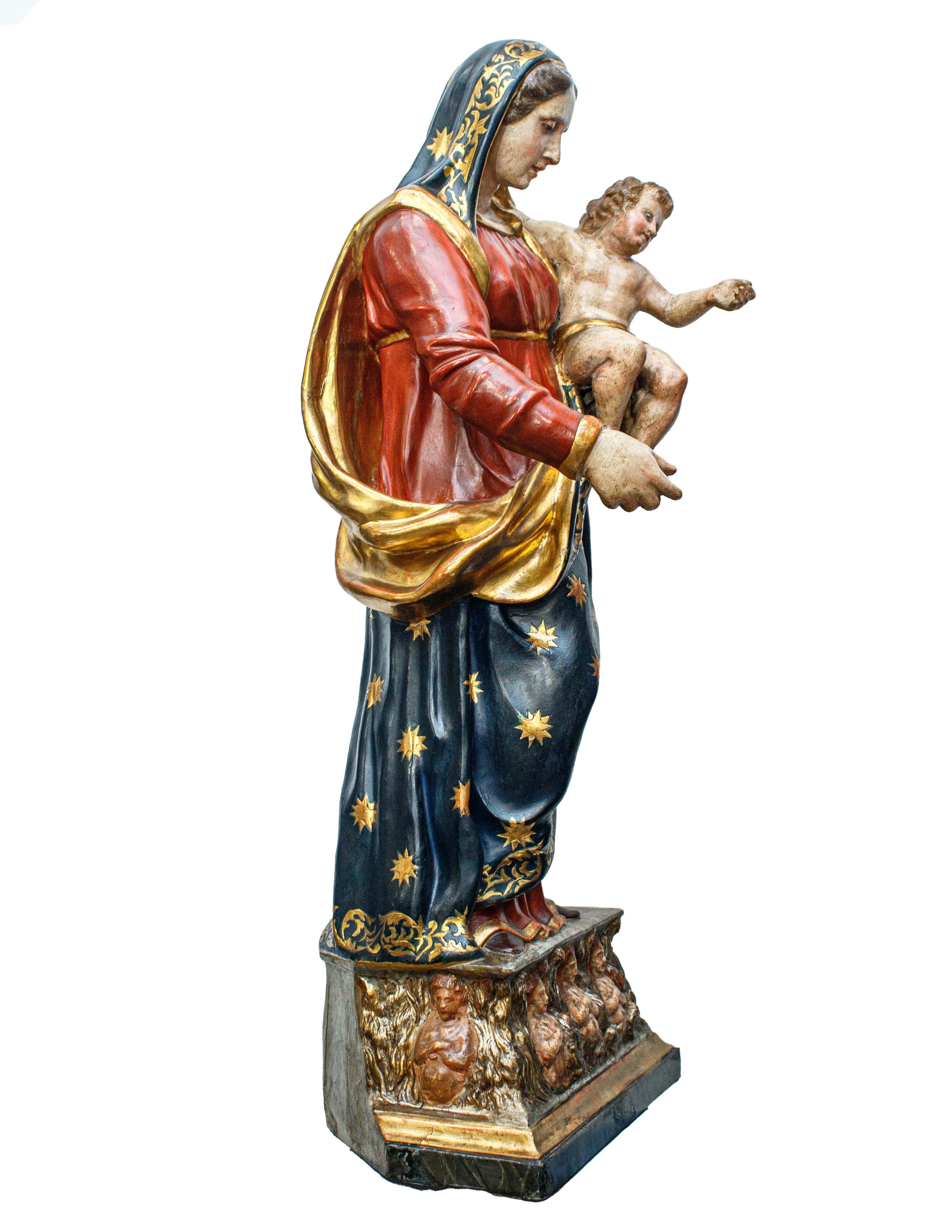 First half of the 19th century

Madonna and Child with souls in Purgatory 

Lacquered and gilded papier-mache with polychrome wooden base

cm 96.5 x 37.5 x 28

