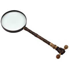 Used 19th Century Magnifying Glass with Hand Holding a Barbell