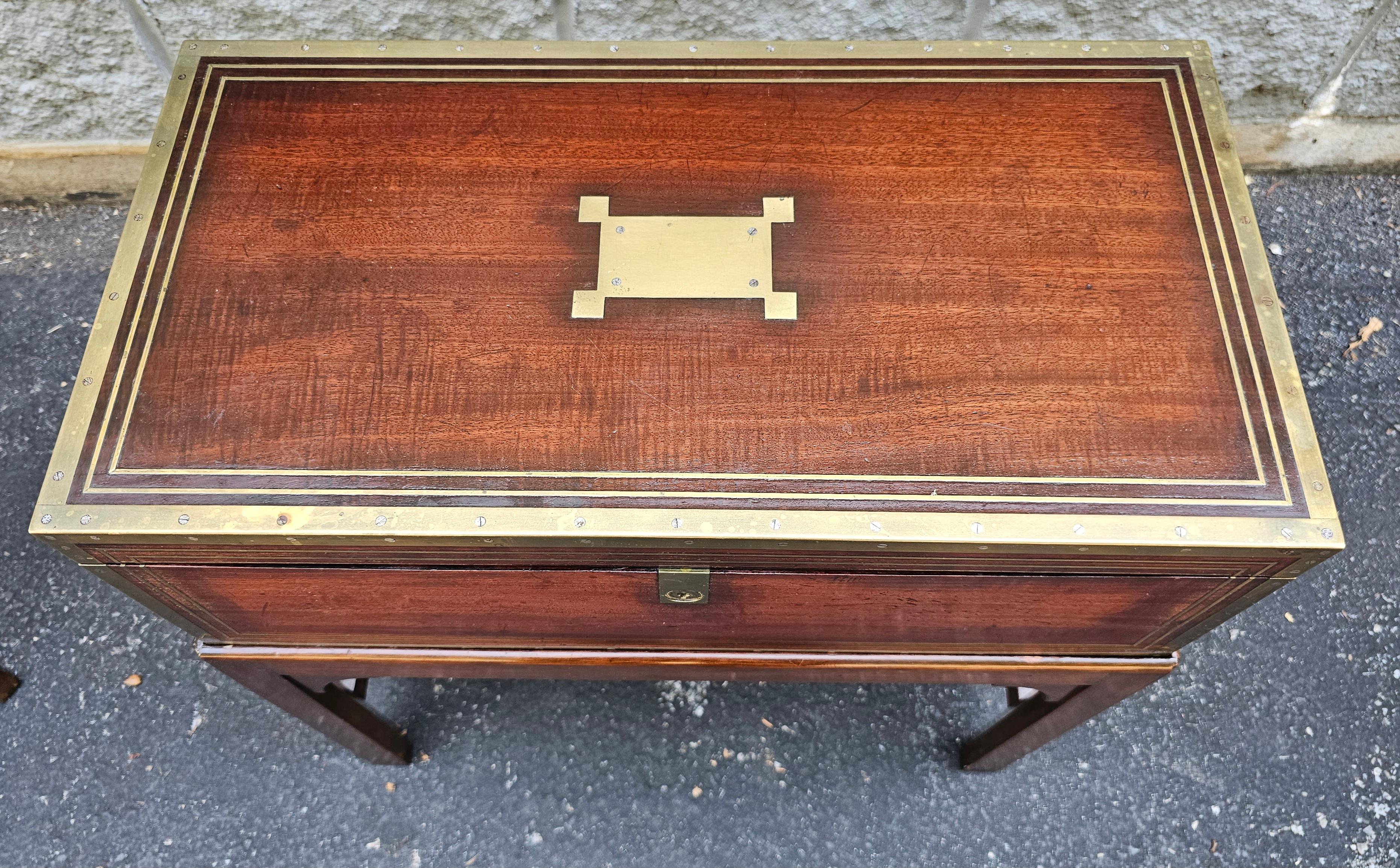 19th Century Mahogany and brass and brass inlays traveling lap desk on stand. Measures 22.5