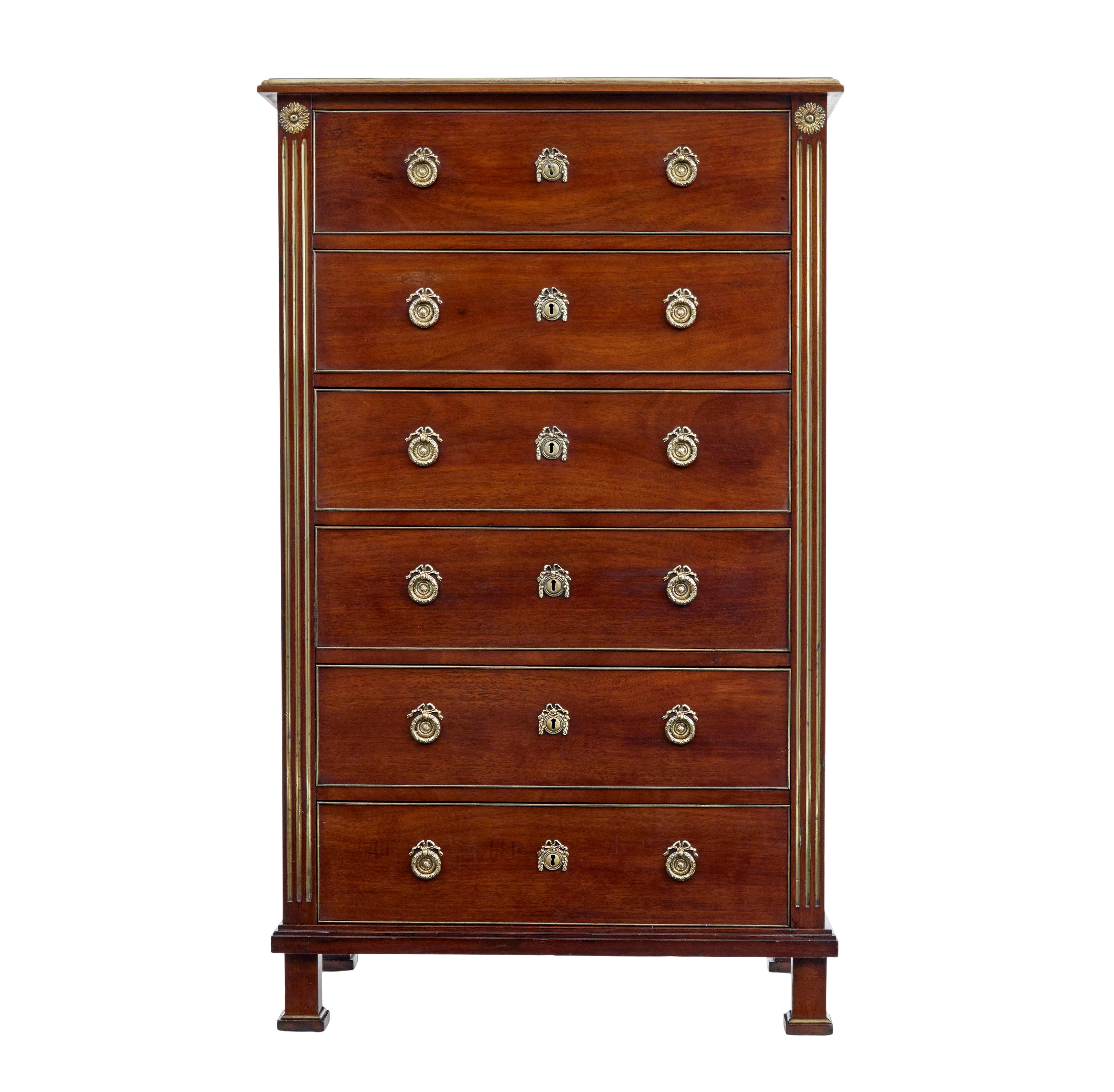 19th century directoire influenced mahogany tall chest of drawers, circa 1890.

Fine quality tall chest in the directoire style. Fitted with 6 drawers of equal proportions and detailed with cock beaded edging that has been carried out in brass.