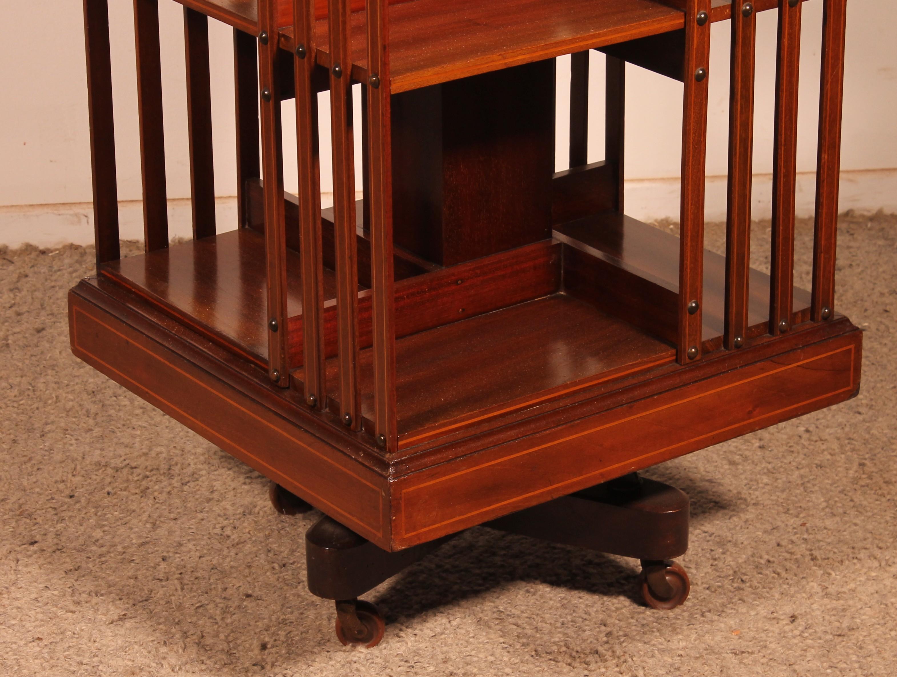 Late Victorian 19th Century Mahogany And Inlaid Revolving Bookcase With Iron Base For Sale