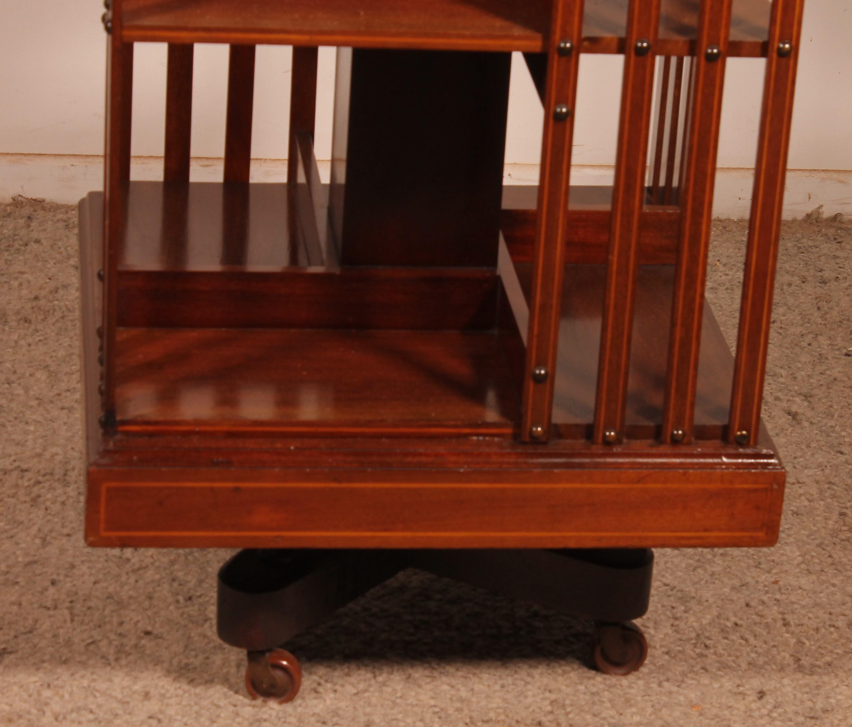 British 19th Century Mahogany And Inlaid Revolving Bookcase With Iron Base For Sale