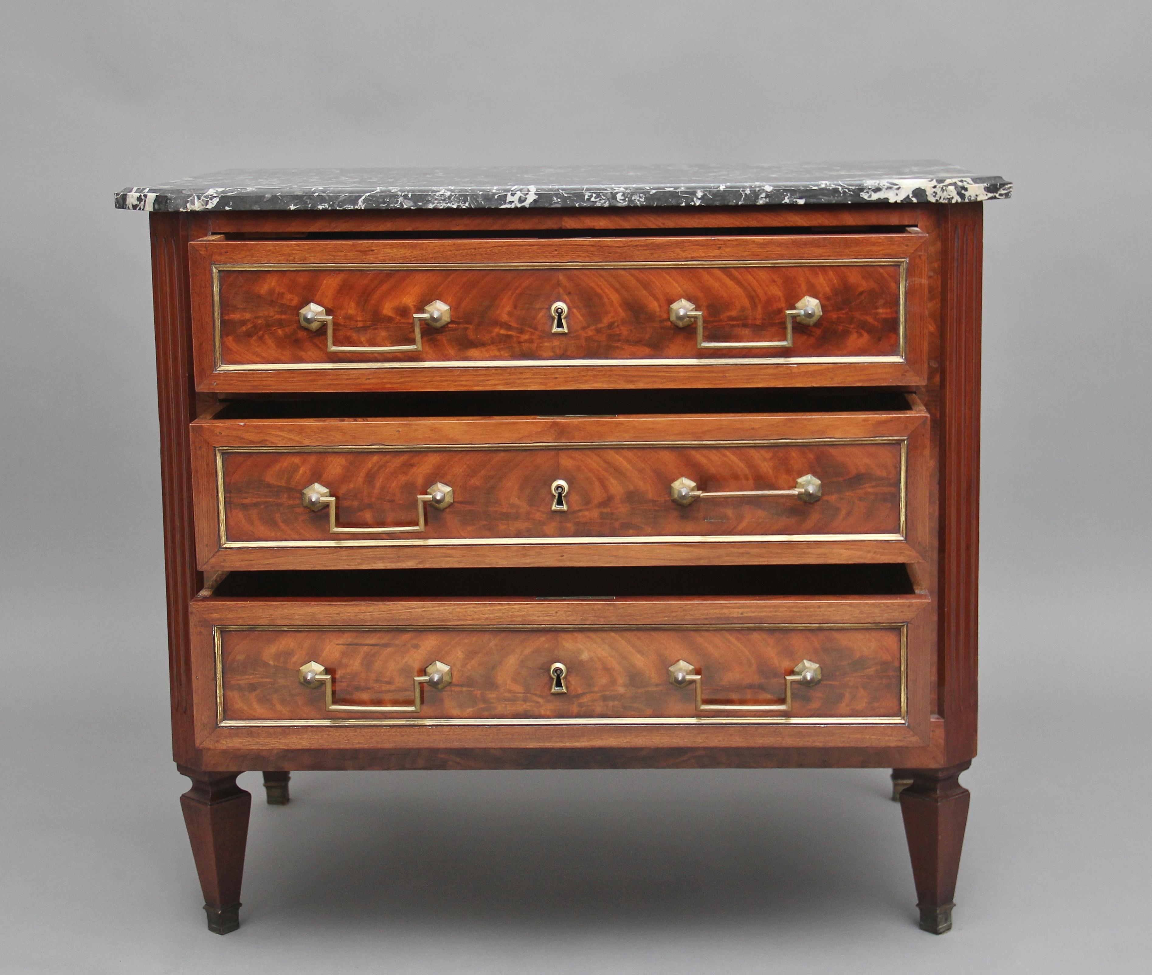 19th century French flame mahogany and marble top chest of good proportions, having a grey and white moulded edge marble top above three oak lined drawers with original brass handles and escutcheons, the drawer fronts decorated with brass mouldings,