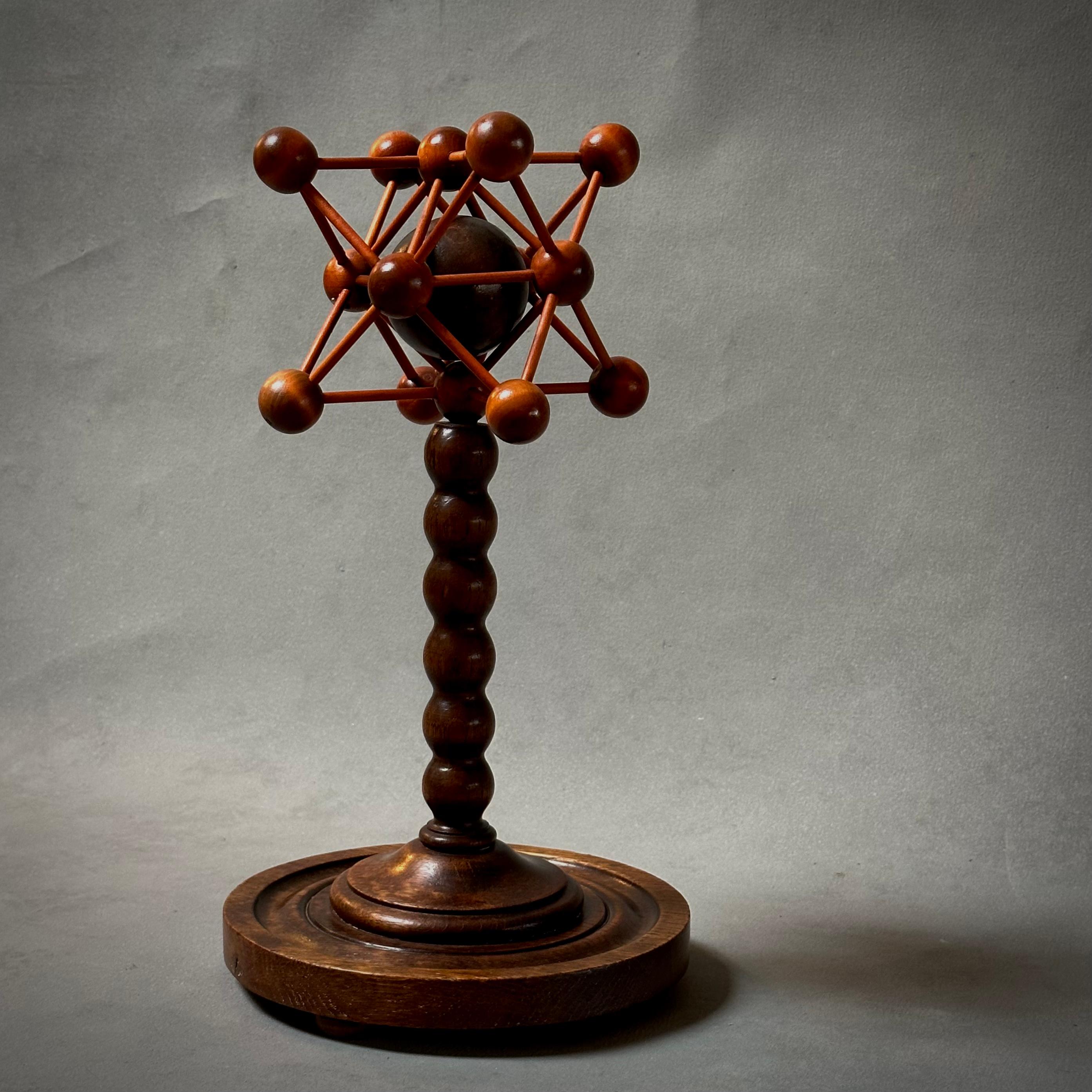 A graphic hand-carved mahogany and oak sculpture or decorative element from early 20th century France. A curious blend of modern and traditional details make for a compelling contrast. 

France, circa 1900

Dimensions: 9W x 9D x 16H.