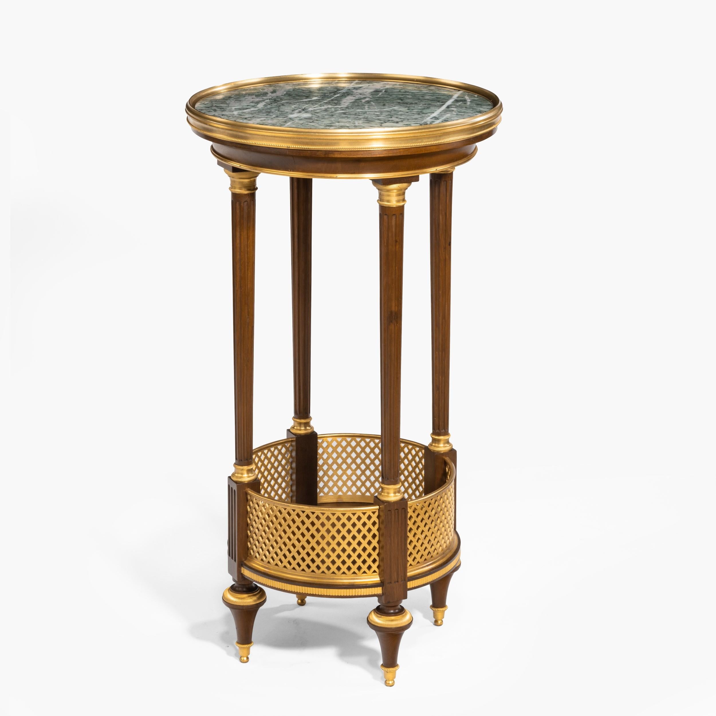 A Gueridon in the Louis XVI Manner
by Paul Sormani
 
Constructed in mahogany and ormolu, with a Campan marble platform; of circular form, supported by gilt bronze toupie feet with four tapering and fluted columns with ormolu capitols and plinths,