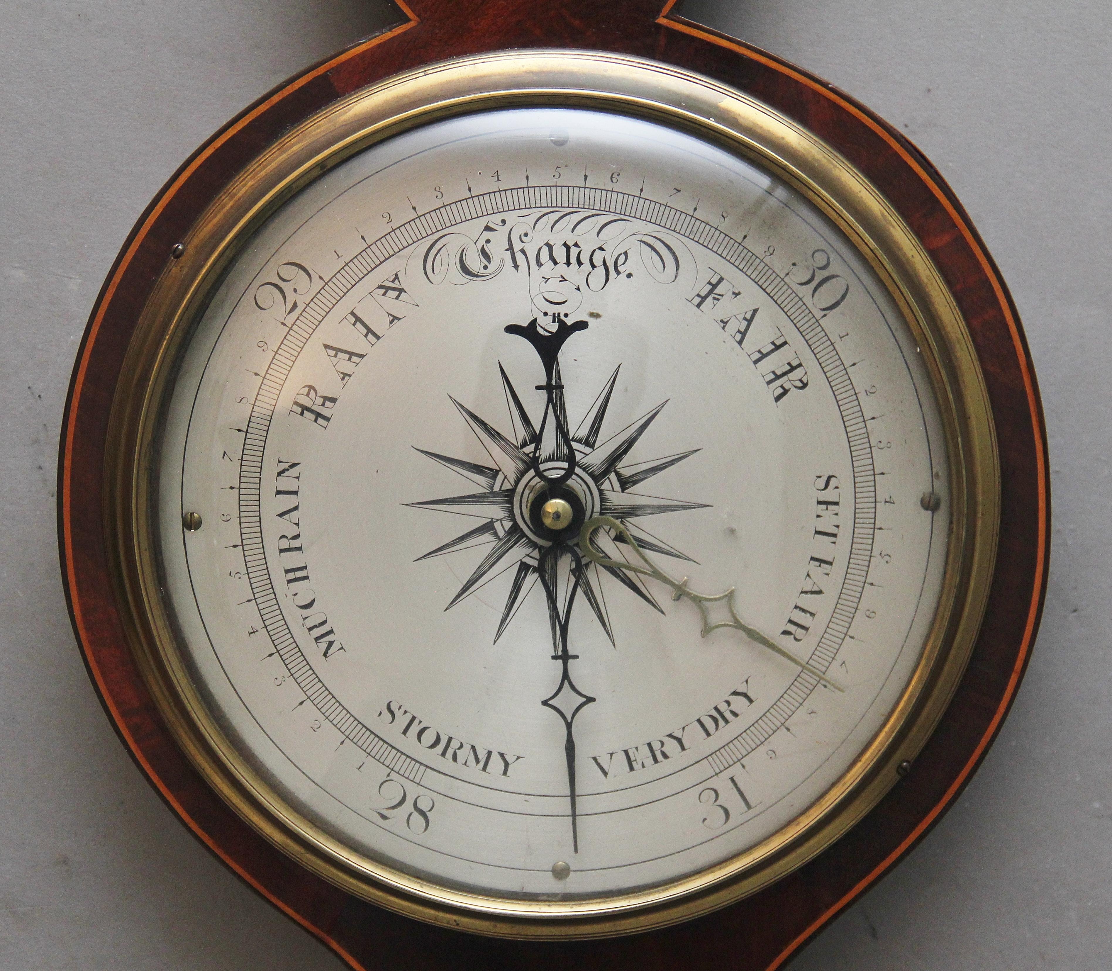 19th century mahogany banjo barometer by P Nolfi of Taunton, having a swan neck pediment with a central brass finial above a shaped mahogany case decorated with boxwood stringing, the barometer includes a hygrometer, thermometer, convex mirror and a