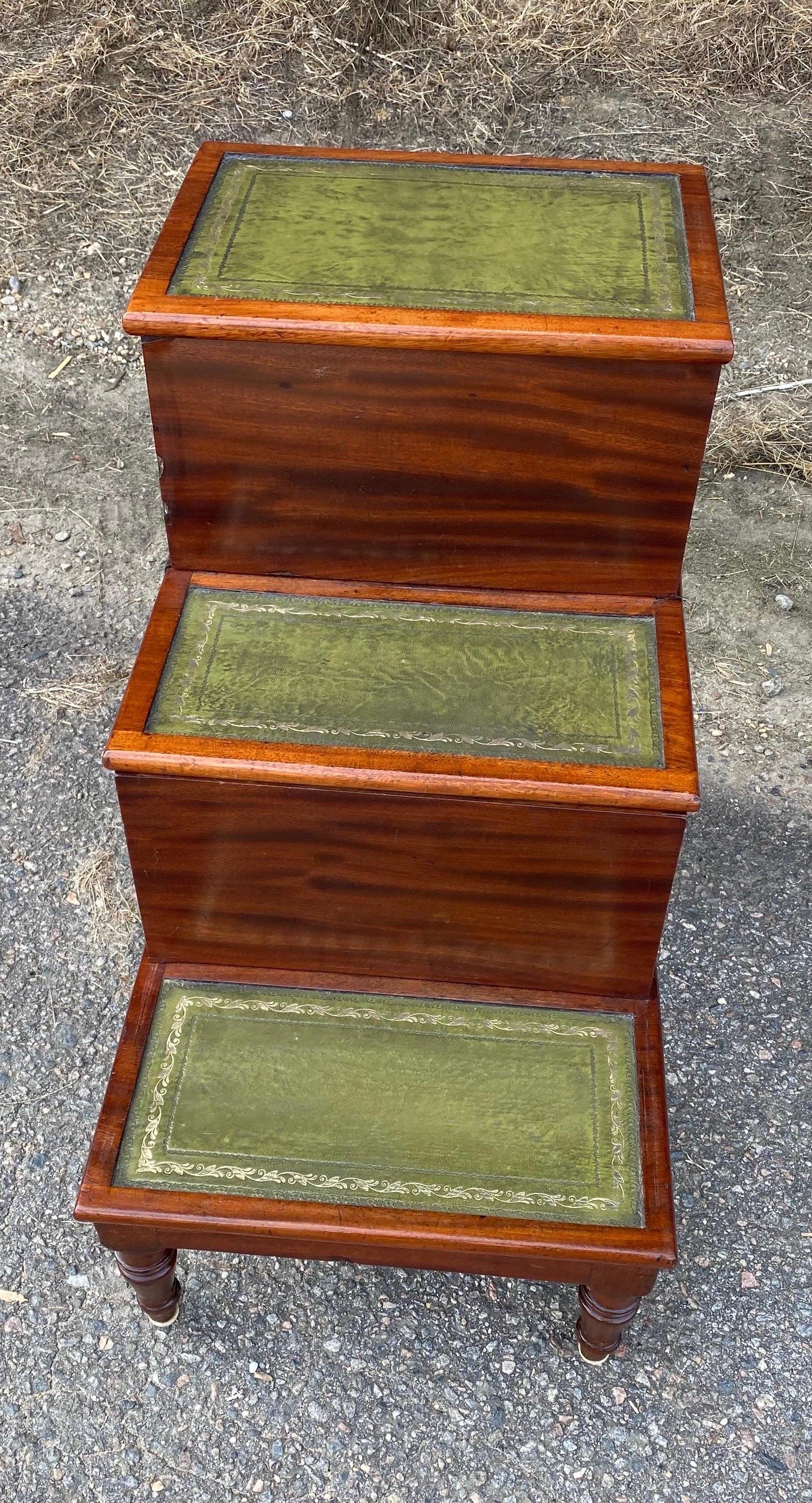 Great set of 19th century English mahogany and leather bedsteps with sliding chamber drawer.