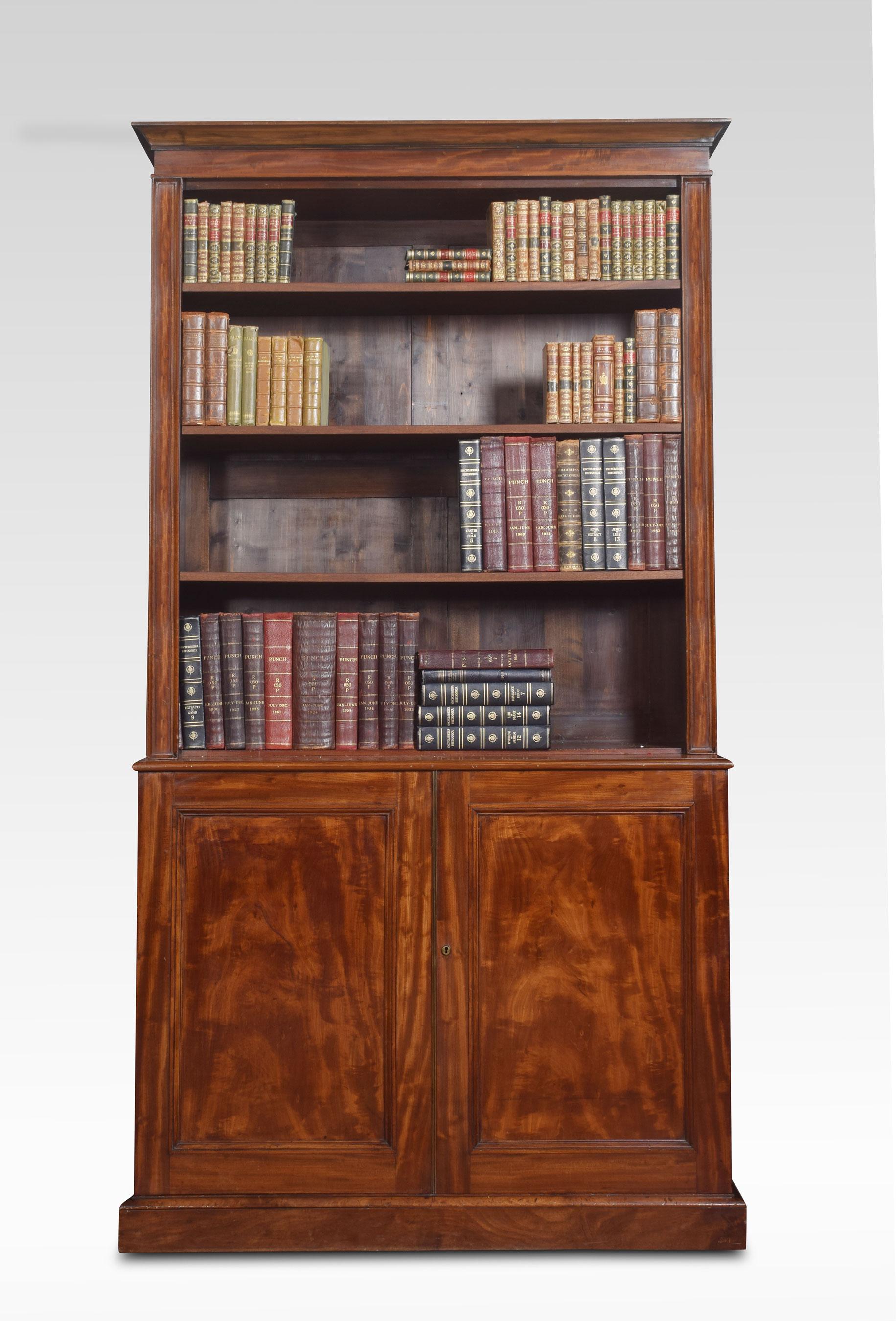 19th century mahogany bookcase the molded cornice above an open-top bookcase having three adjustable shelves. To the base fitted with a pair of well-figured doors opening to reveal cupboard base with a single shelf. All raised up on plinth