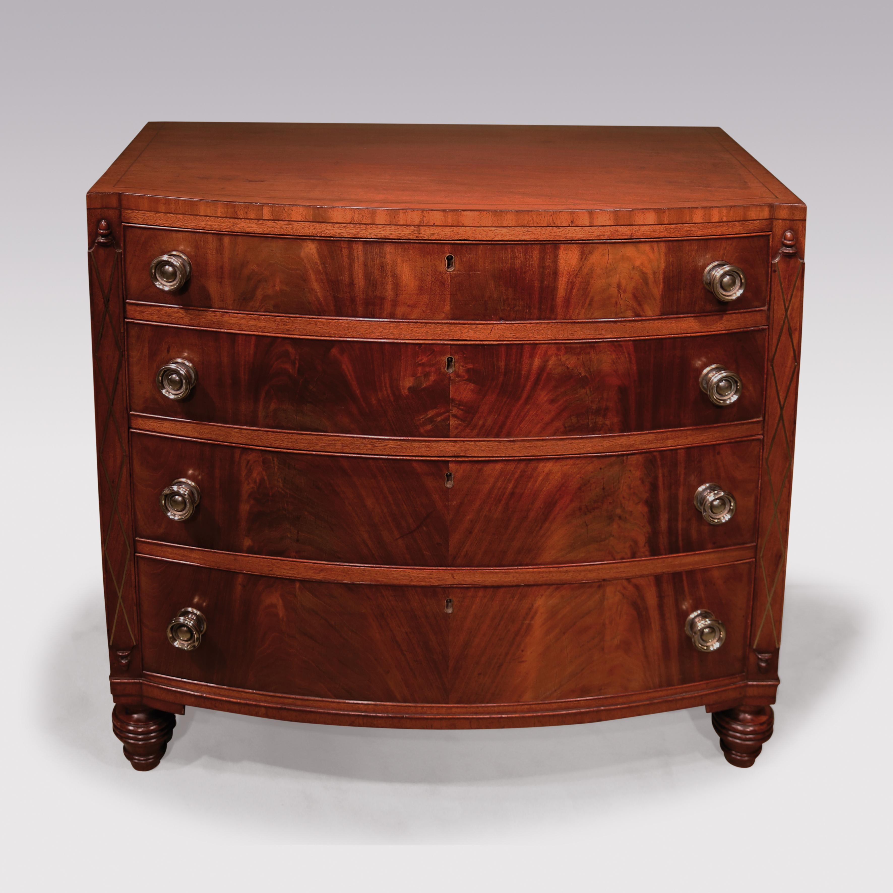An early 19th century Regency period bow chest stamped ‘GILLOWS’ veneered in flame figured mahogany having ebony strung top above four cockbeaded drawers, retaining original brass handles, flanked by lattice brass inlaid ‘columns’ with acorn