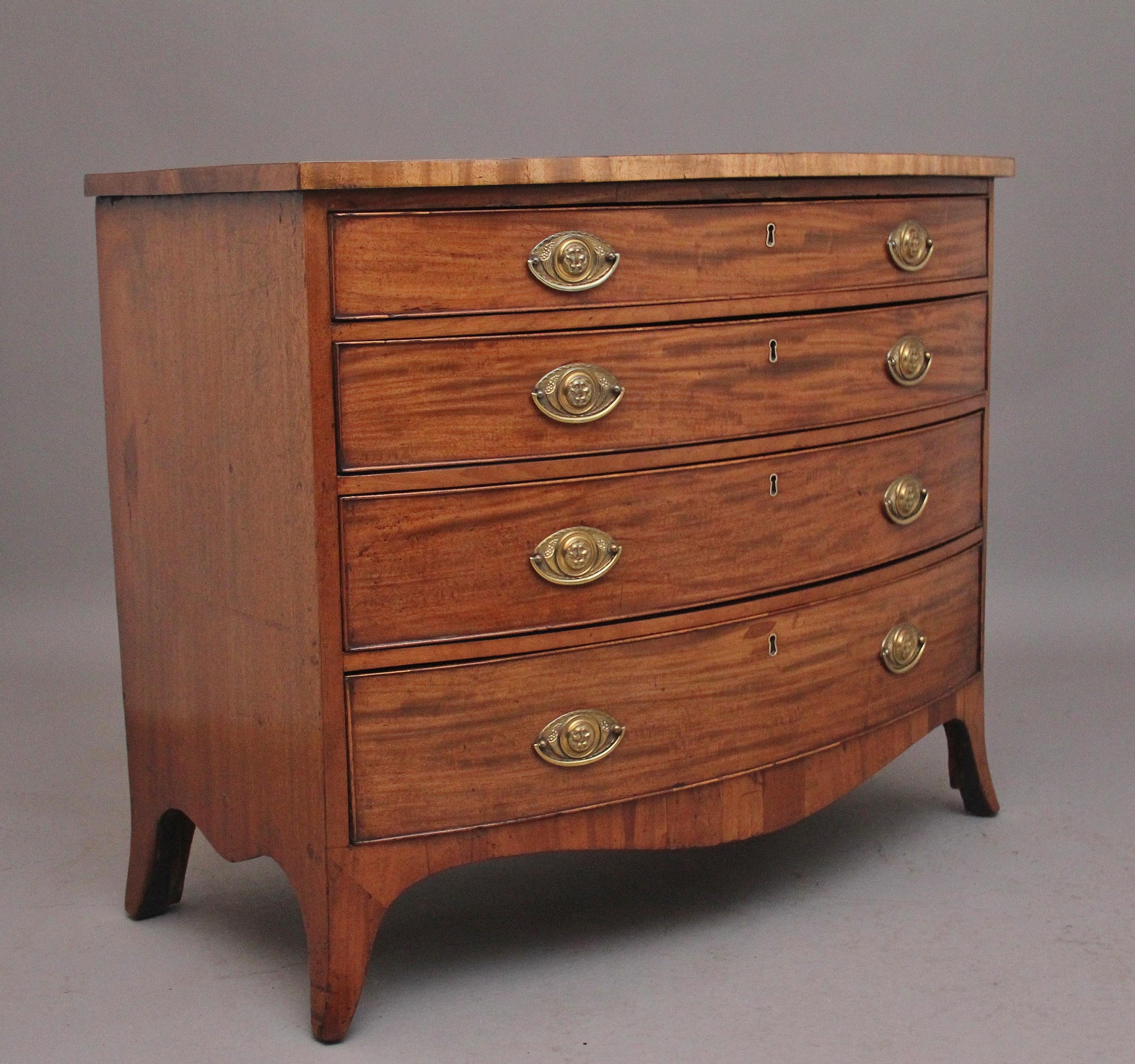 A superb quality early 19th Century mahogany bowfront chest of drawers, having a nice figured top above four graduated oak lined drawers with brass engraved oval plate handles, shaped apron below and supported on splay feet.  Circa 1820.
