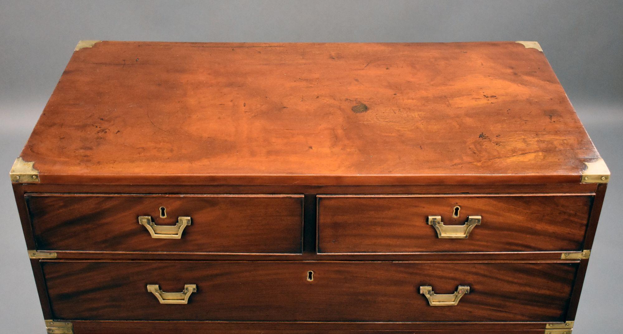 For sale is a good quality 19th century mahogany campaign style chest, having three drawers in the top (two short over one long) with a further two long drawers in the base, each with brass military handles. Both the top and bottom of the chest have