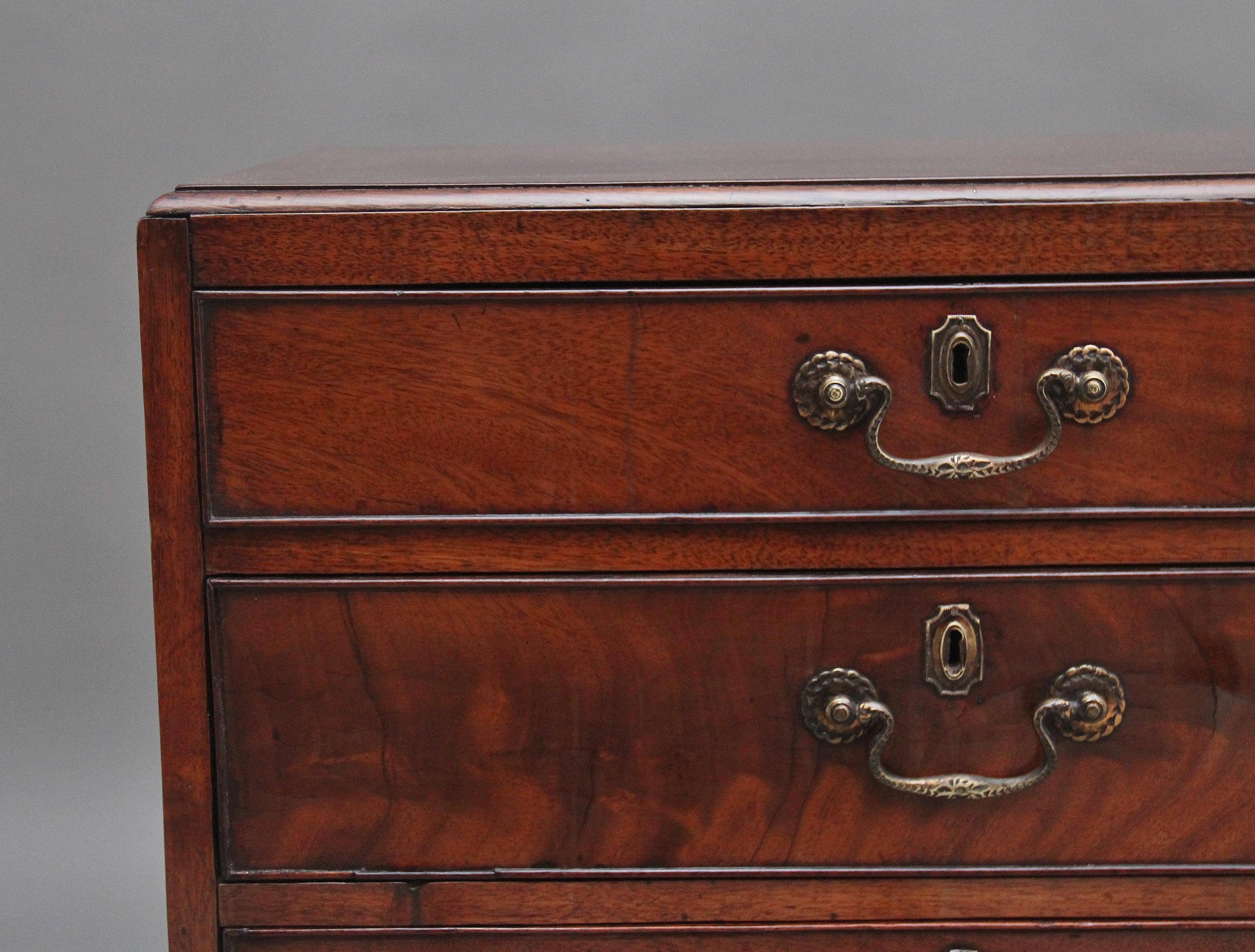 A fabulous quality 19th Century mahogany chest of drawers in the Georgian style, the moulded edge top above four graduated oak lined drawers with the original brass engraved swan neck handles and escutcheons, wonderful figuration on the drawer