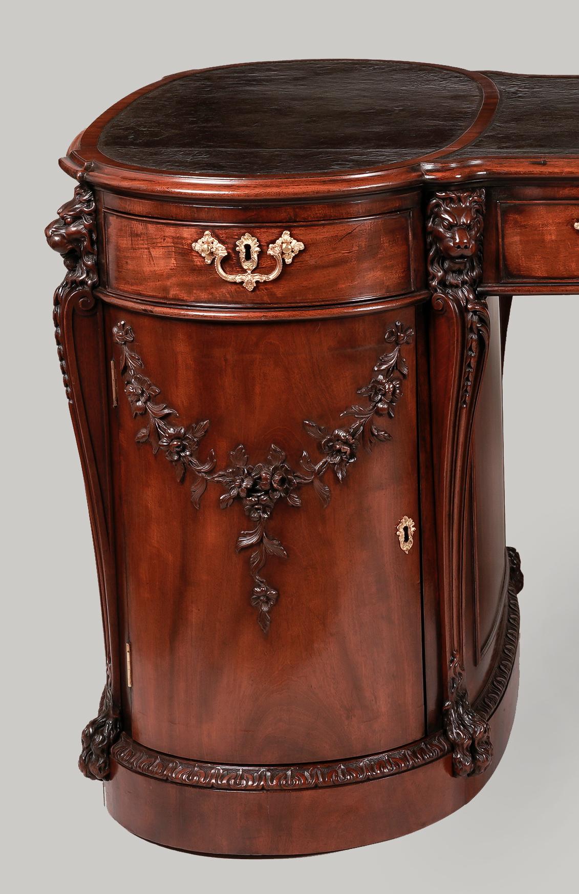 A high quality partners library table
By H Samuel of Oxford street

The design by Thomas Chippendale


Constructed in mahogany, of hour-glass shape, the plinth base having stiff-leaf carved mouldings; nine cock beaded drawers with swan gilt