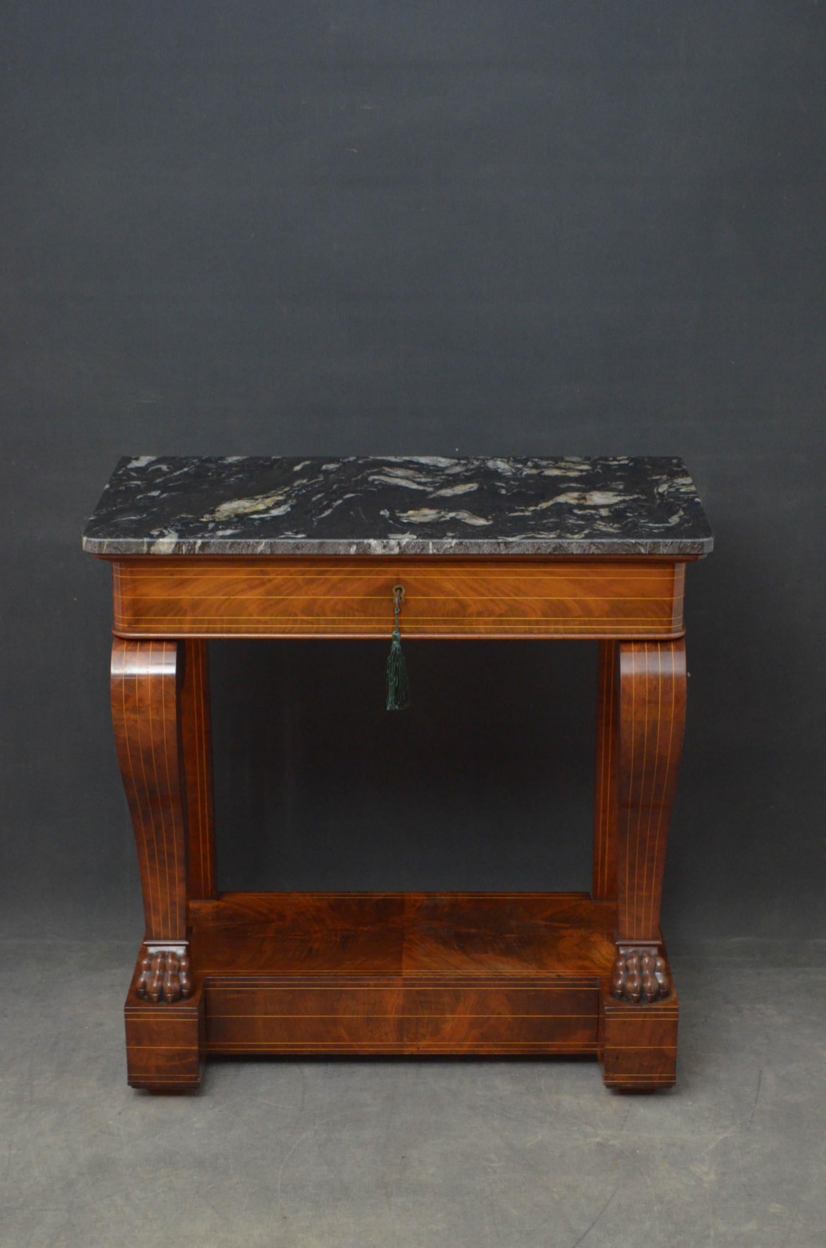 Sn4679 Fine quality French hall table in mahogany, having marble top above flamed mahogany, satinwood string inlaid drawer fitted with original working lock and a key, raised on S shaped inlaid supports with paw feet terminating in flamed mahogany