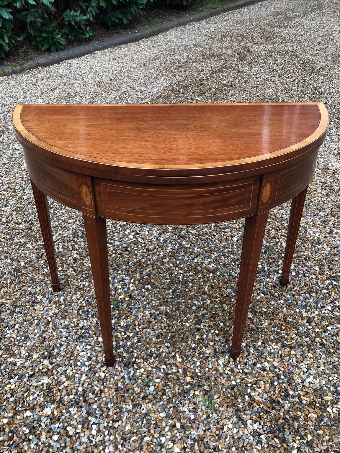 19th century Georgian mahogany demilune card table with satinwood inlay on square tapering legs. With newly fitted baize.

circa 1820-1830

Dimensions:
Height: 29 inches – 74 cms
Width: 37 inches – 94 cms
Depth: 18 inches – 46